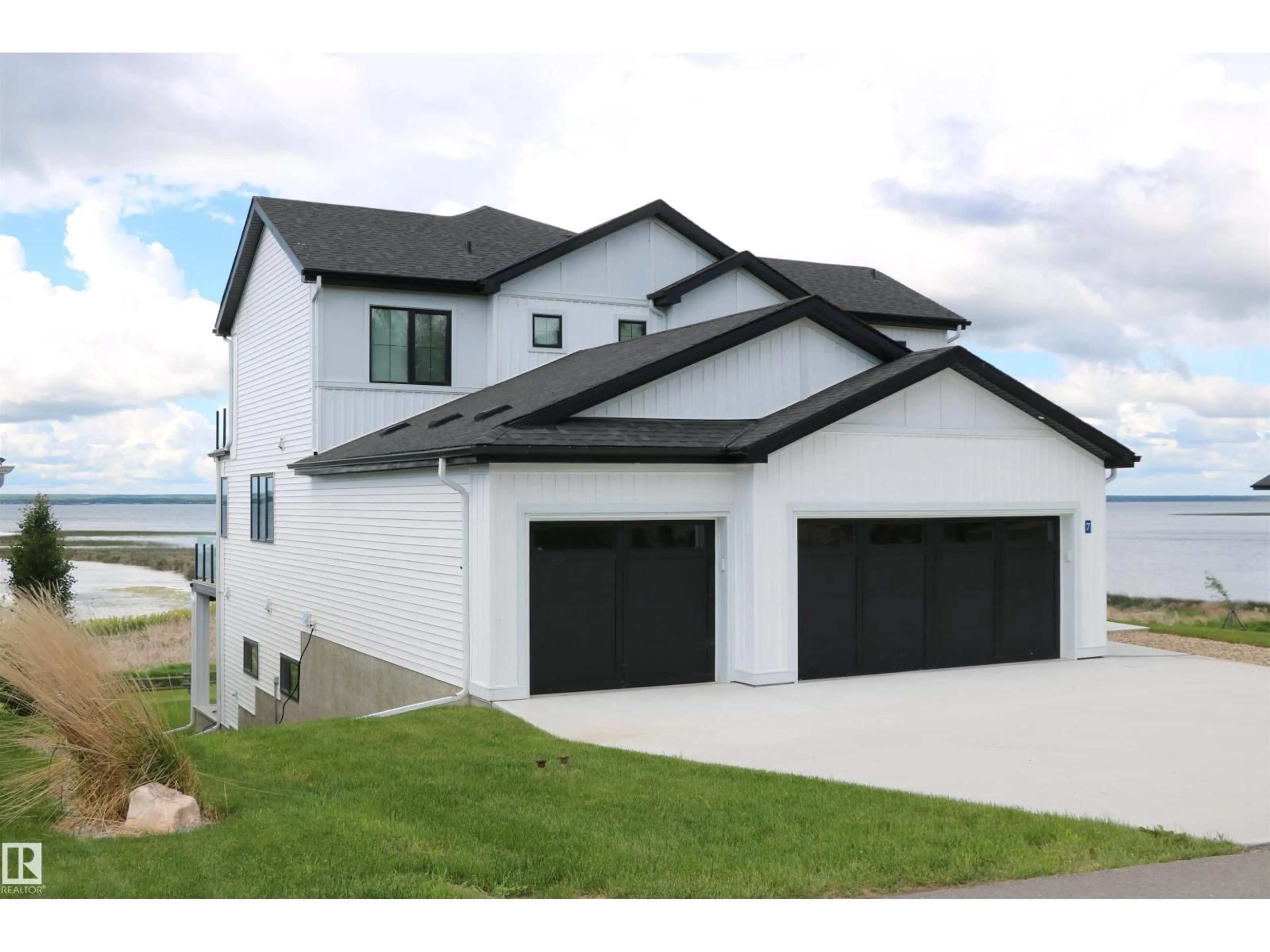 Home with vinyl exterior material, street for STE. - 7 ANNE TR, Rural Lac Ste. Anne County Alberta T0E1A1