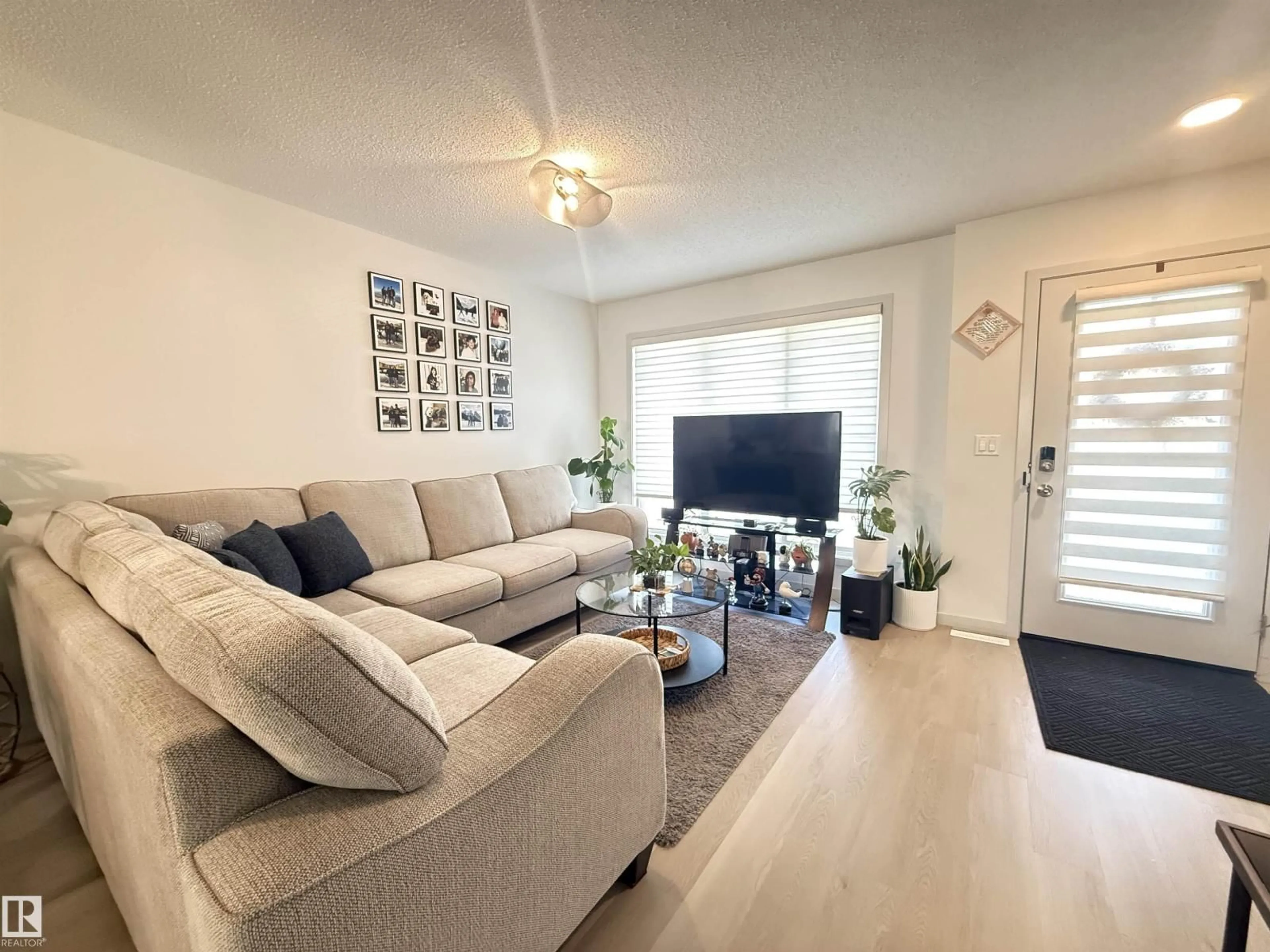 Living room with furniture, unknown for 6283 176 AV, Edmonton Alberta T5Y4E5
