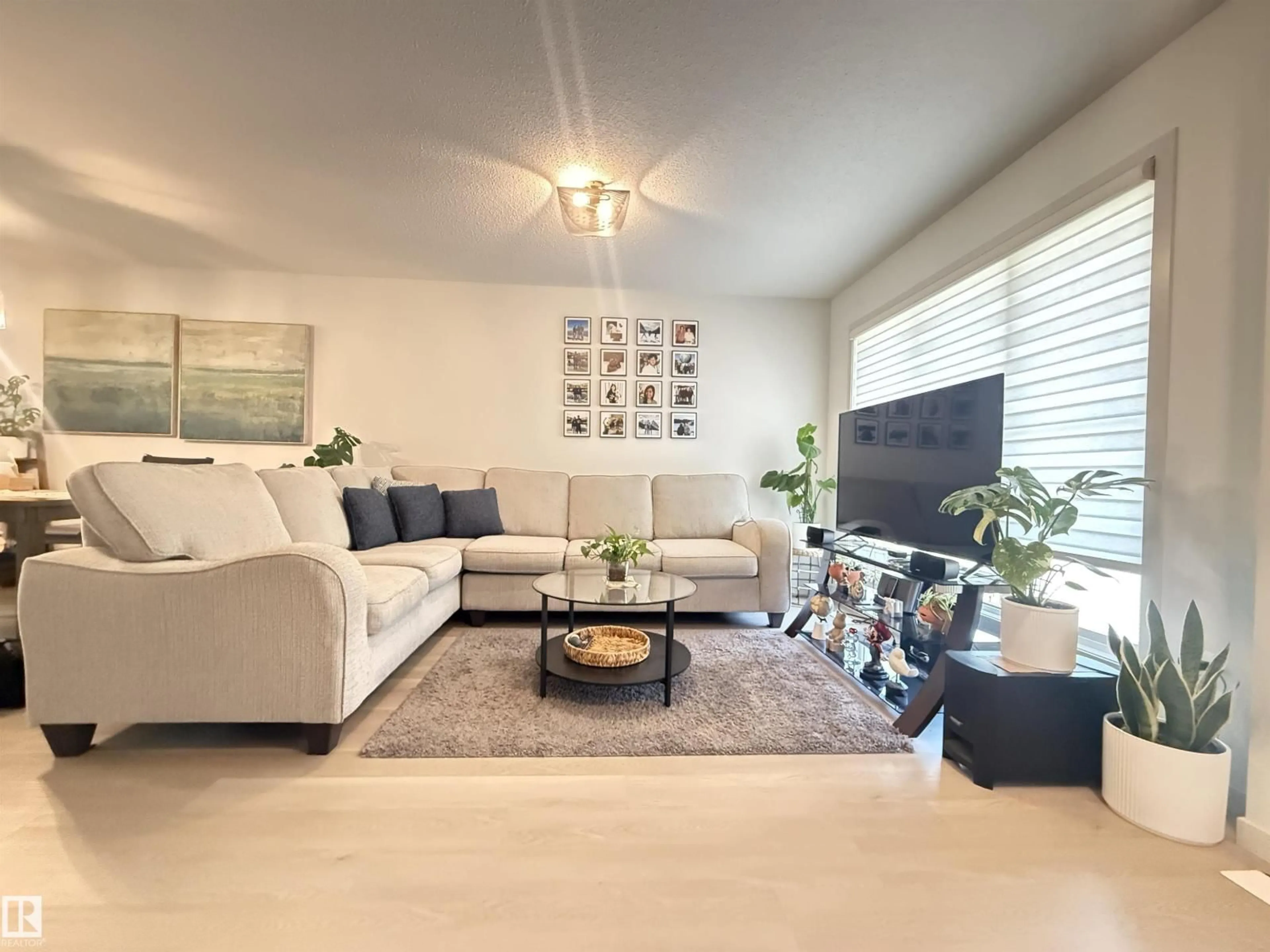 Living room with furniture, unknown for 6283 176 AV, Edmonton Alberta T5Y4E5