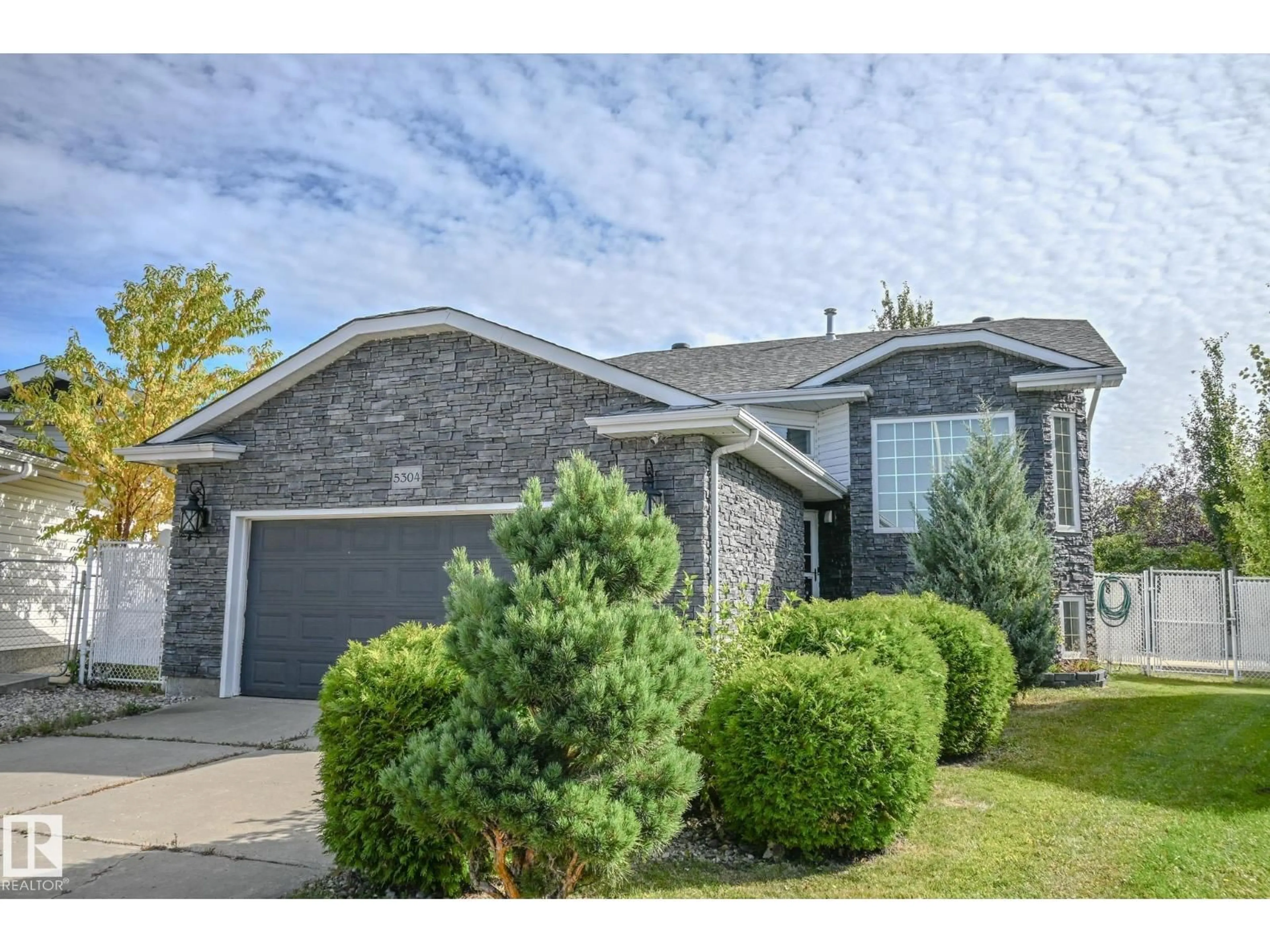 Home with brick exterior material, street for NW - 5304 155 AV, Edmonton Alberta T5Y2S6