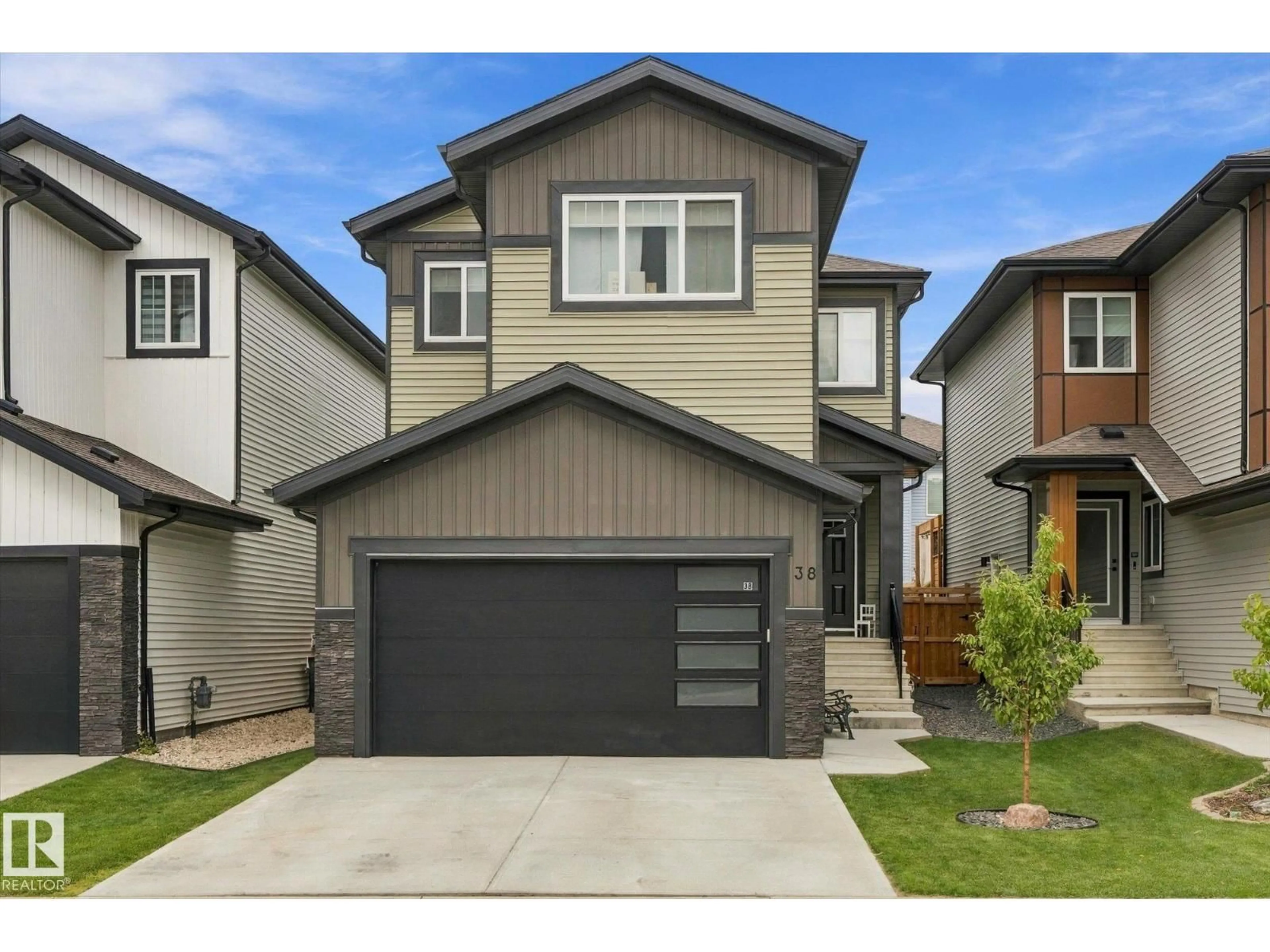 Home with vinyl exterior material, street for 38 STARLING WY, Fort Saskatchewan Alberta T8L0Y1