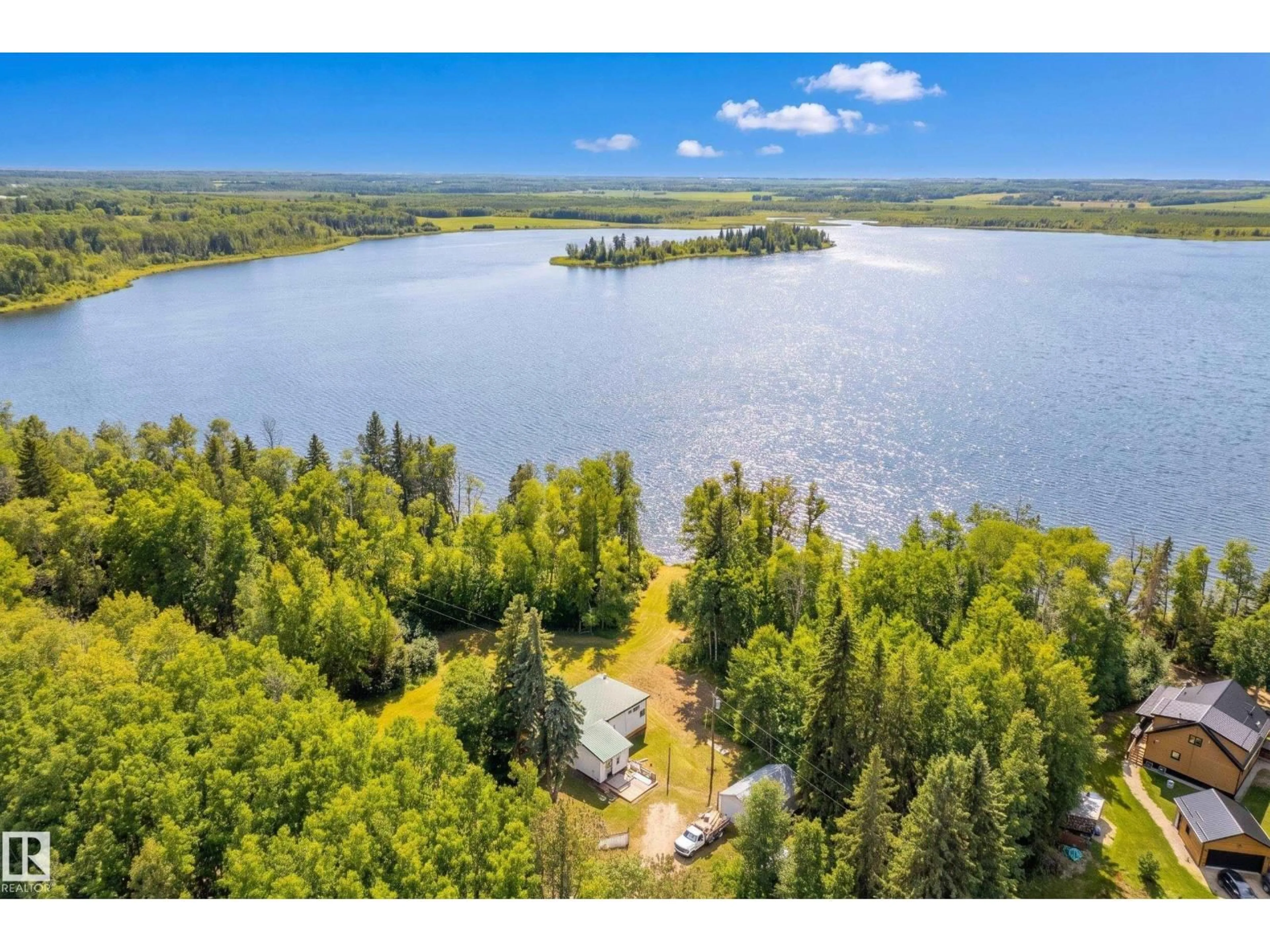 A pic from outside/outdoor area/front of a property/back of a property/a pic from drone, water/lake/river/ocean view for 52502 - 106 RGE ROAD 25, Rural Parkland County Alberta T7Y2M2