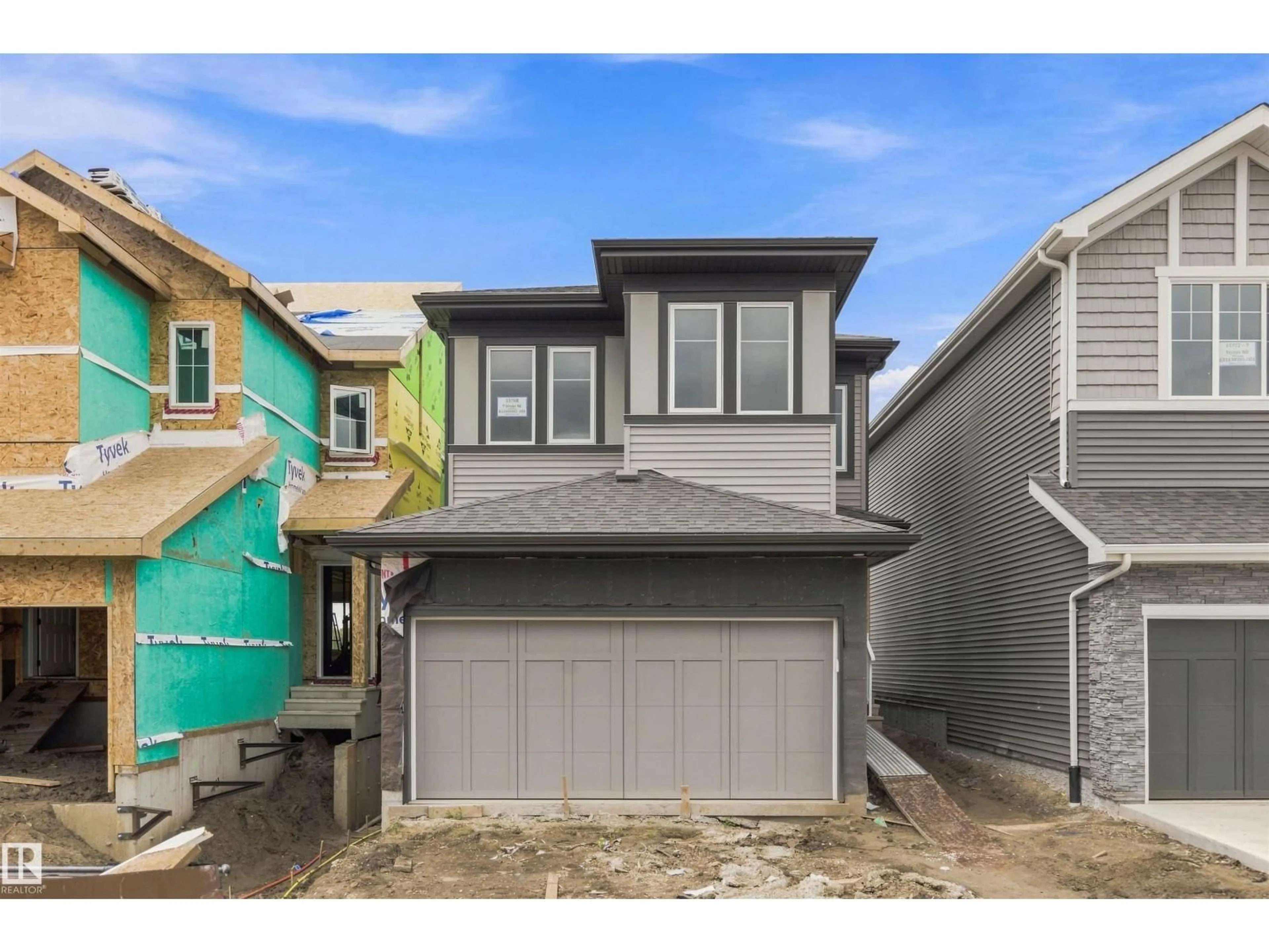 Home with vinyl exterior material, street for NE - 15768 7 ST, Edmonton Alberta T5Y4M6