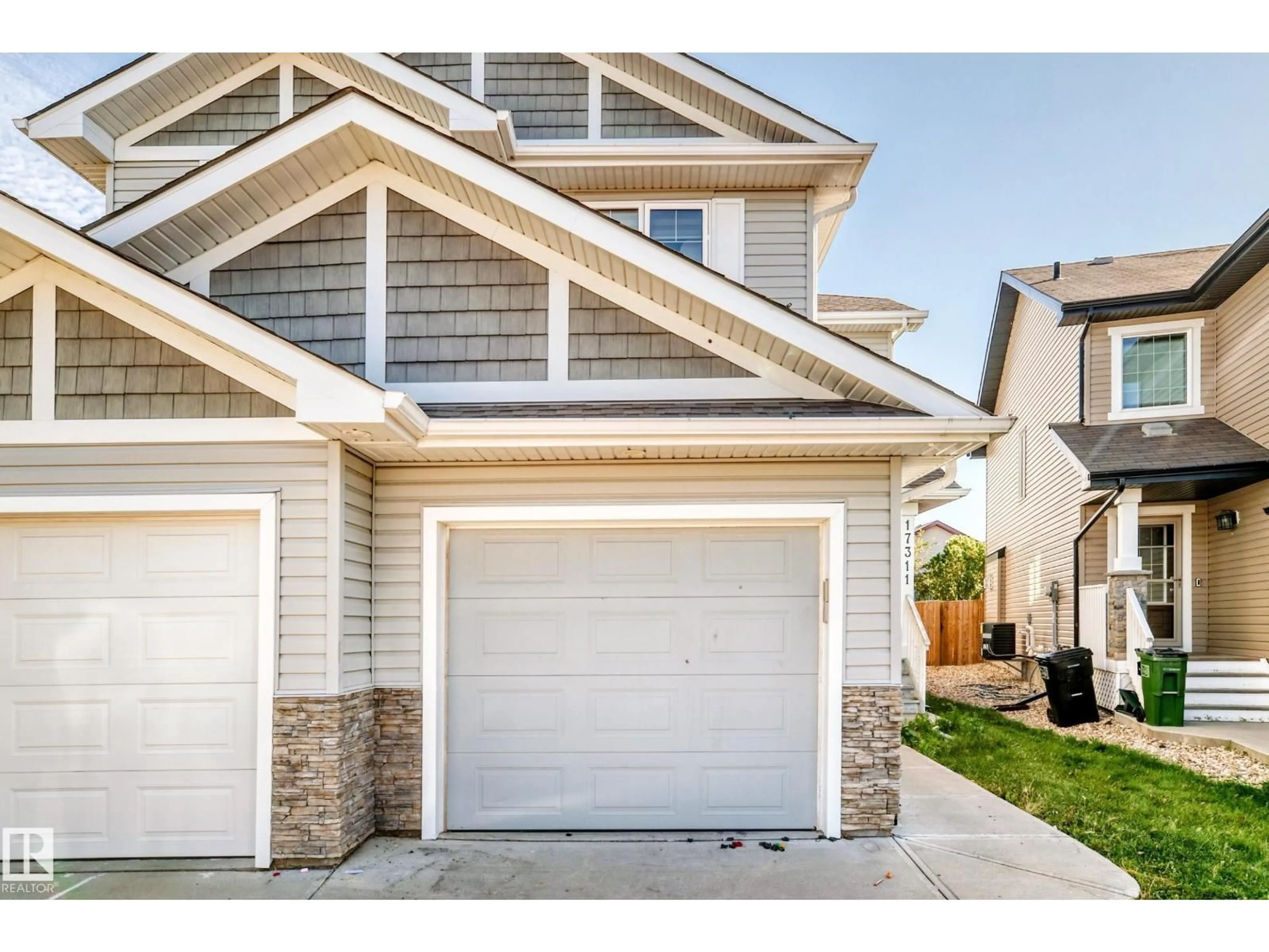 Home with vinyl exterior material, street for 17311 120 ST NW, Edmonton Alberta T5X0J6