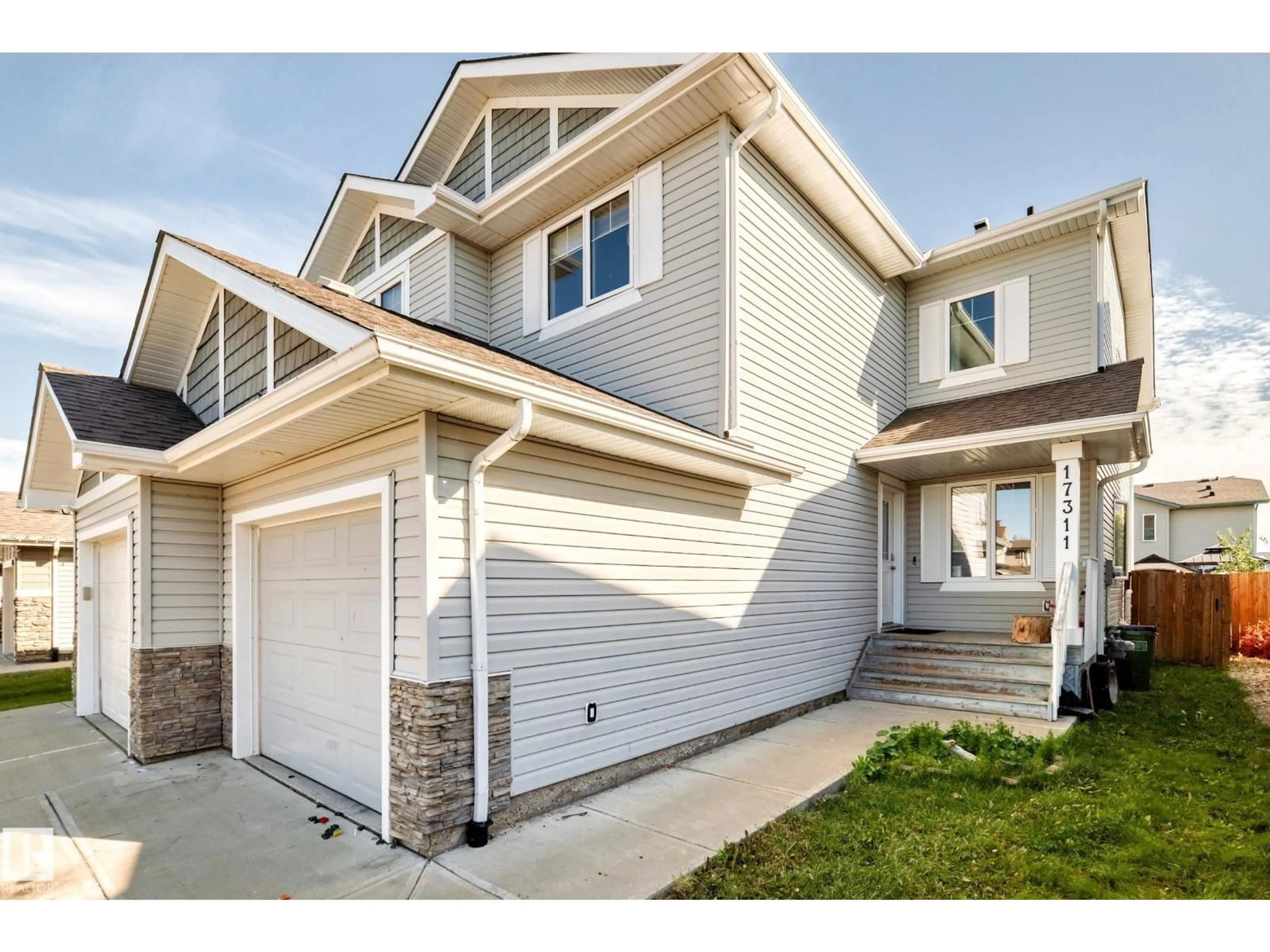 Home with vinyl exterior material, street for 17311 120 ST NW, Edmonton Alberta T5X0J6