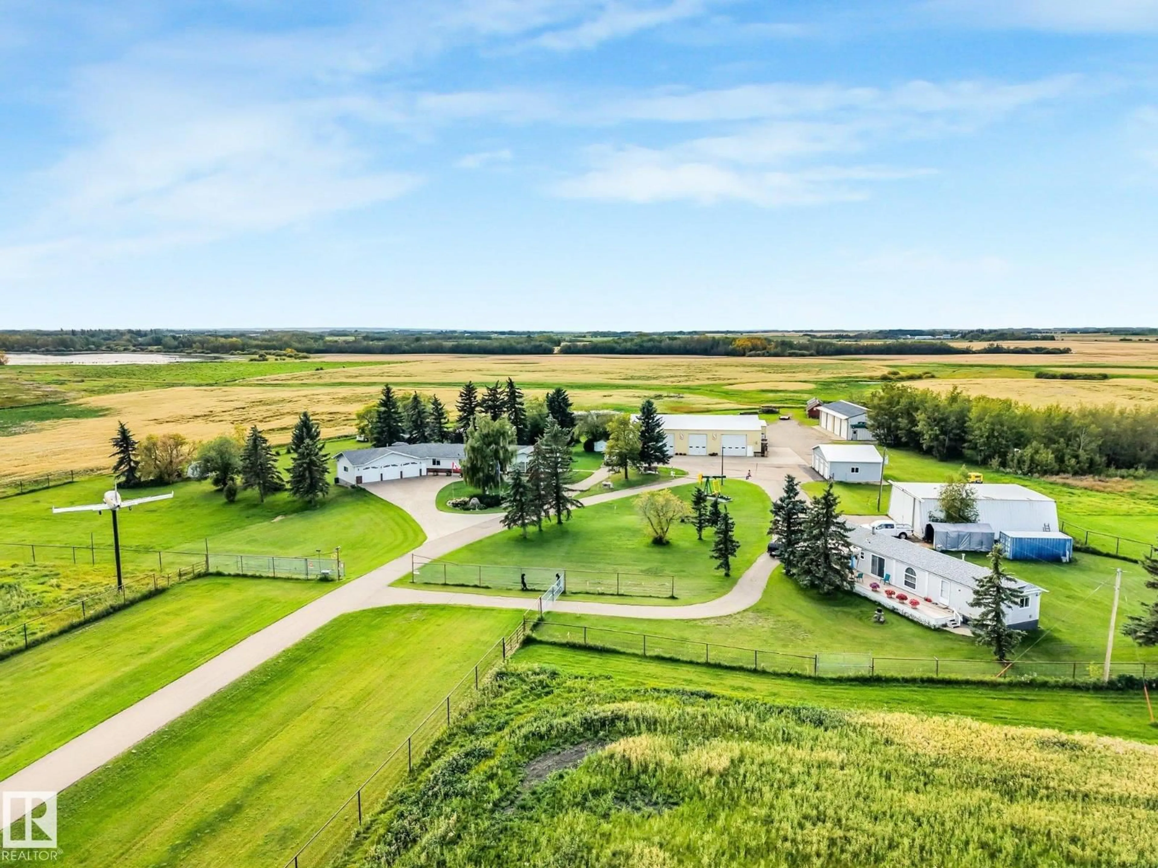 A pic from outside/outdoor area/front of a property/back of a property/a pic from drone, water/lake/river/ocean view for 55120 HIGHWAY 2 NW, Rural Sturgeon County Alberta T8R1P4
