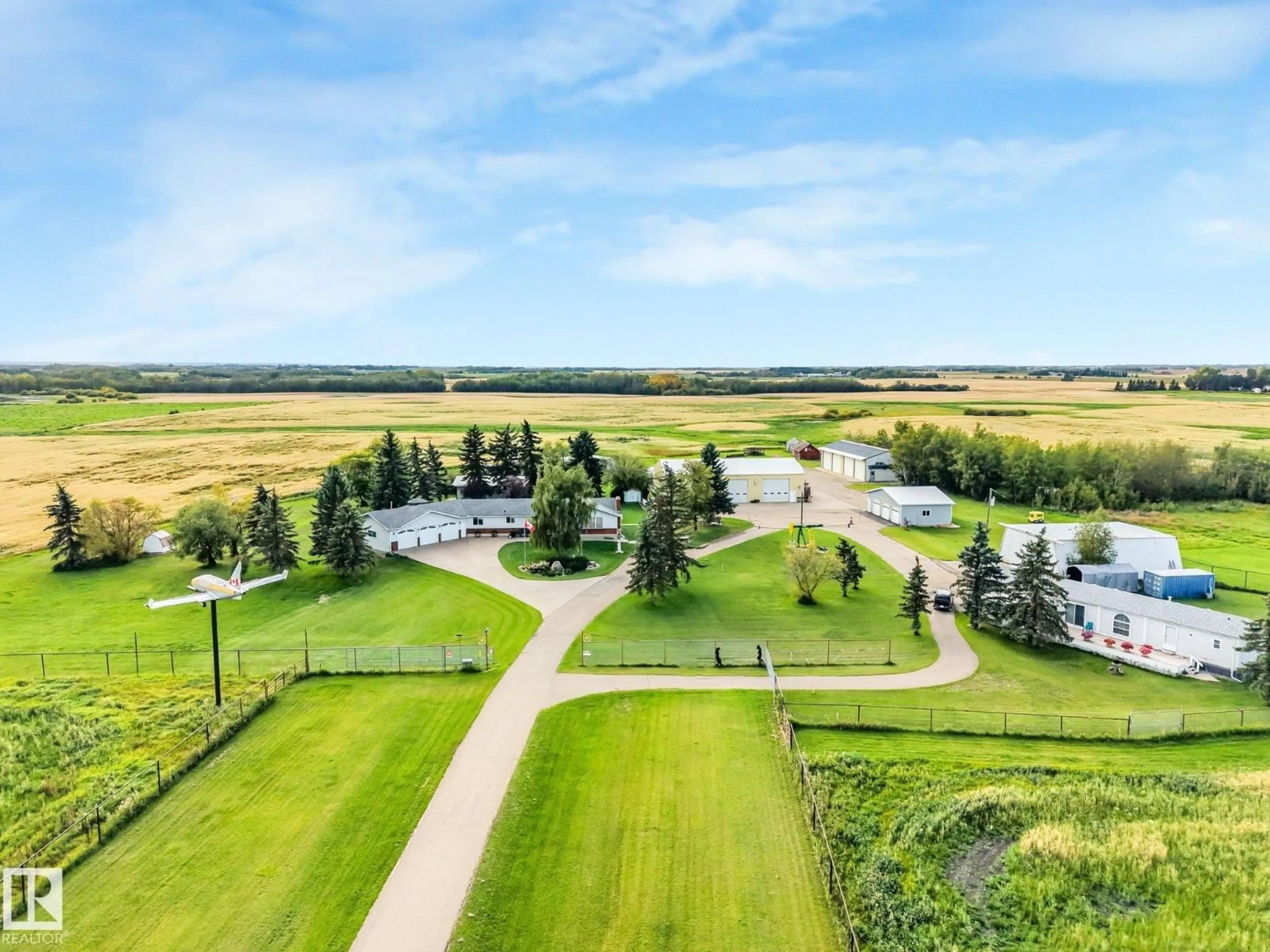 A pic from outside/outdoor area/front of a property/back of a property/a pic from drone, unknown for 55120 HIGHWAY 2 NW, Rural Sturgeon County Alberta T8R1P4