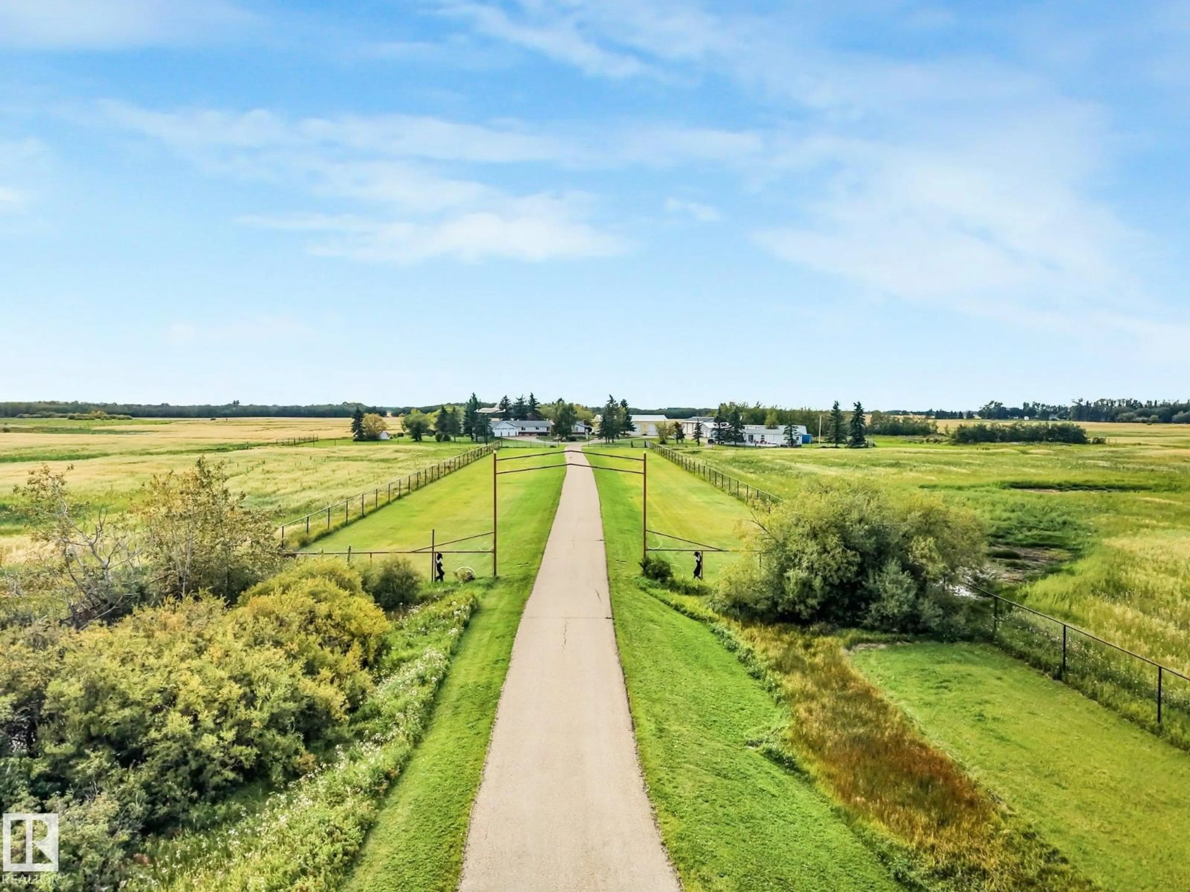 A pic from outside/outdoor area/front of a property/back of a property/a pic from drone, unknown for 55120 HIGHWAY 2 NW, Rural Sturgeon County Alberta T8R1P4