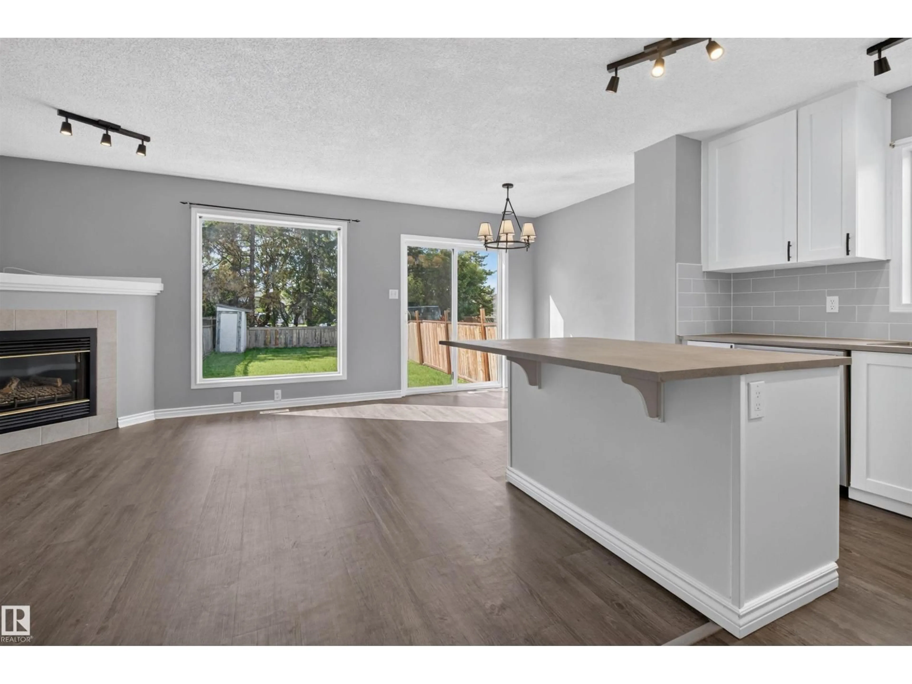 Open concept kitchen, wood/laminate floor for NW - 13510 33 ST, Edmonton Alberta T5A5E1