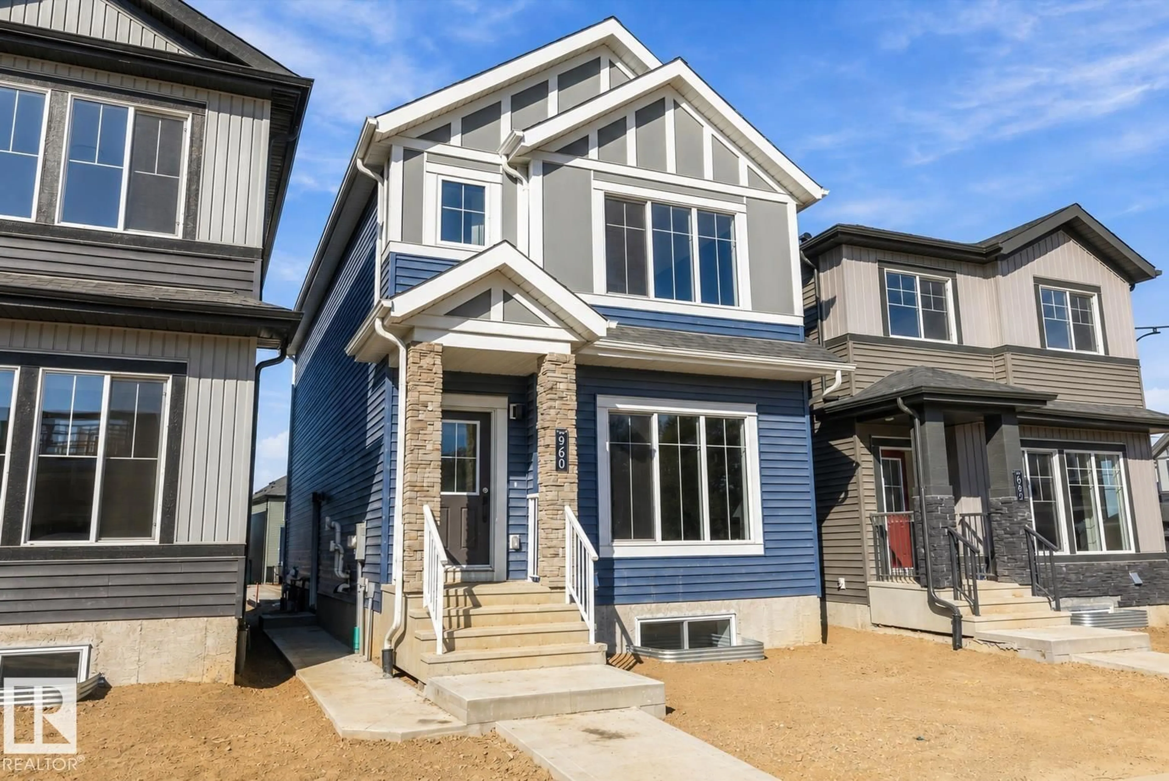 Home with vinyl exterior material, street for 960 ELDERBERRY LD, Edmonton Alberta T6M3K3