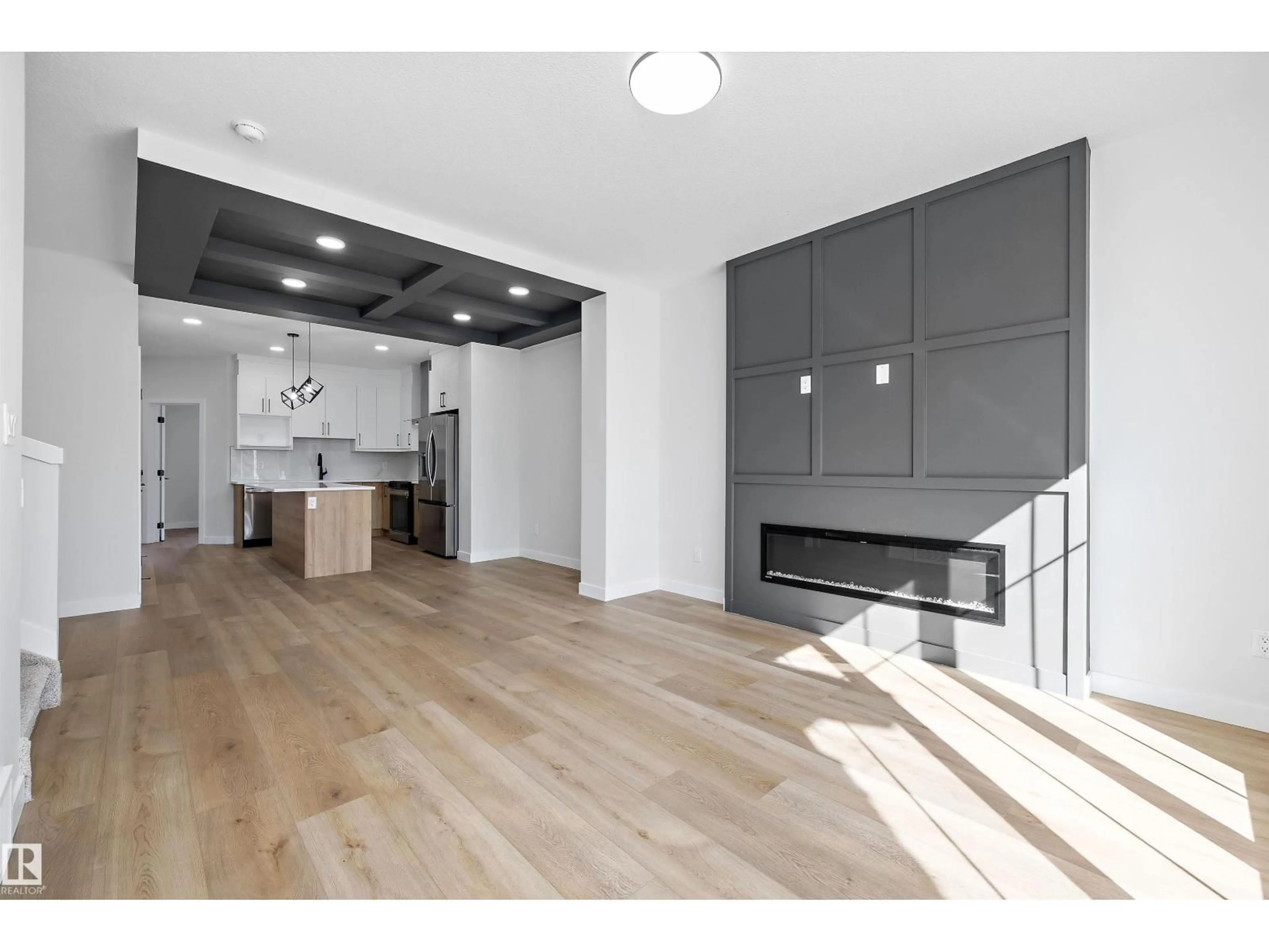 Open concept kitchen, wood/laminate floor for 960 ELDERBERRY LD, Edmonton Alberta T6M3K3