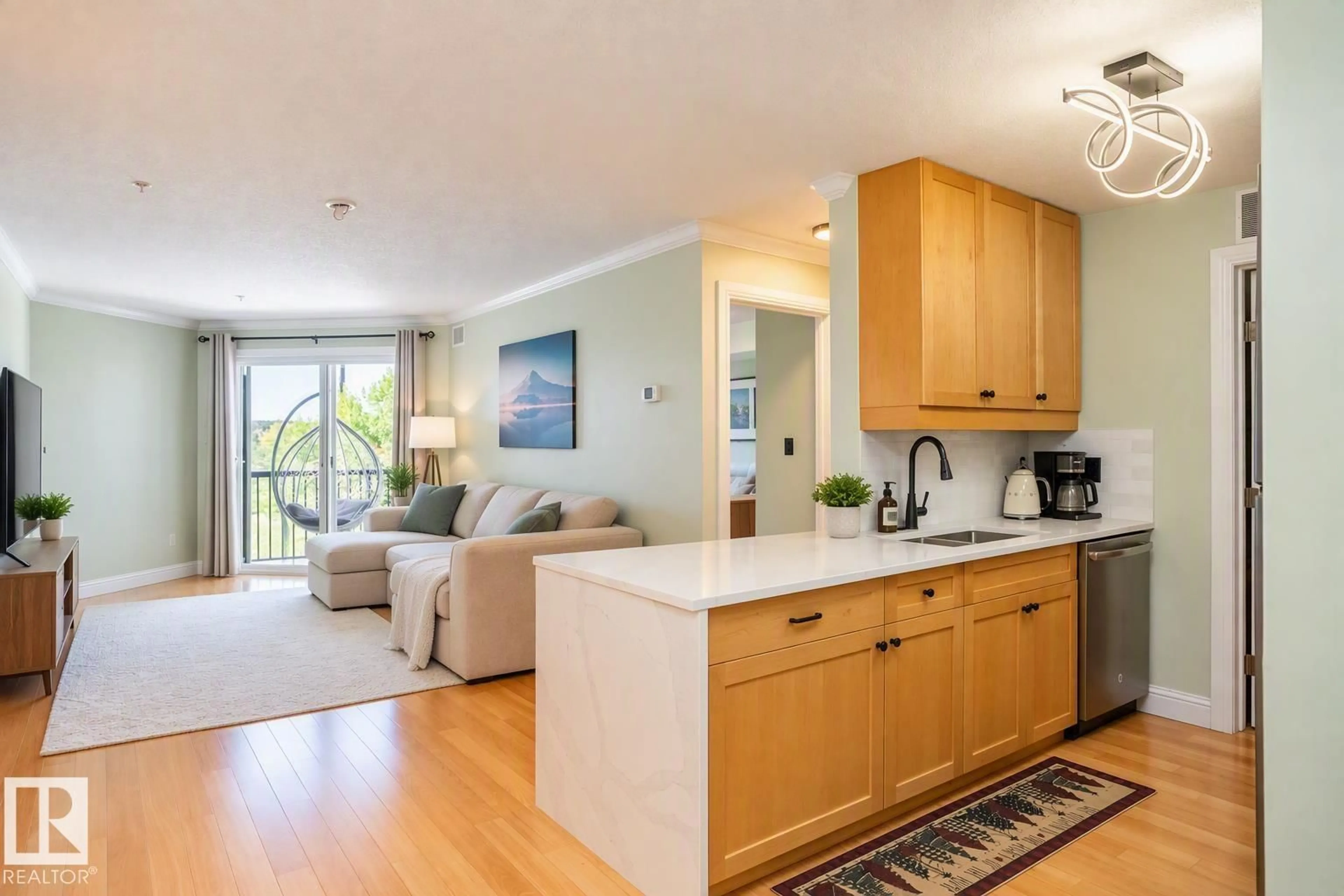 Open concept kitchen, wood/laminate floor for #307 - 13111 140 AV, Edmonton Alberta T6V0B1