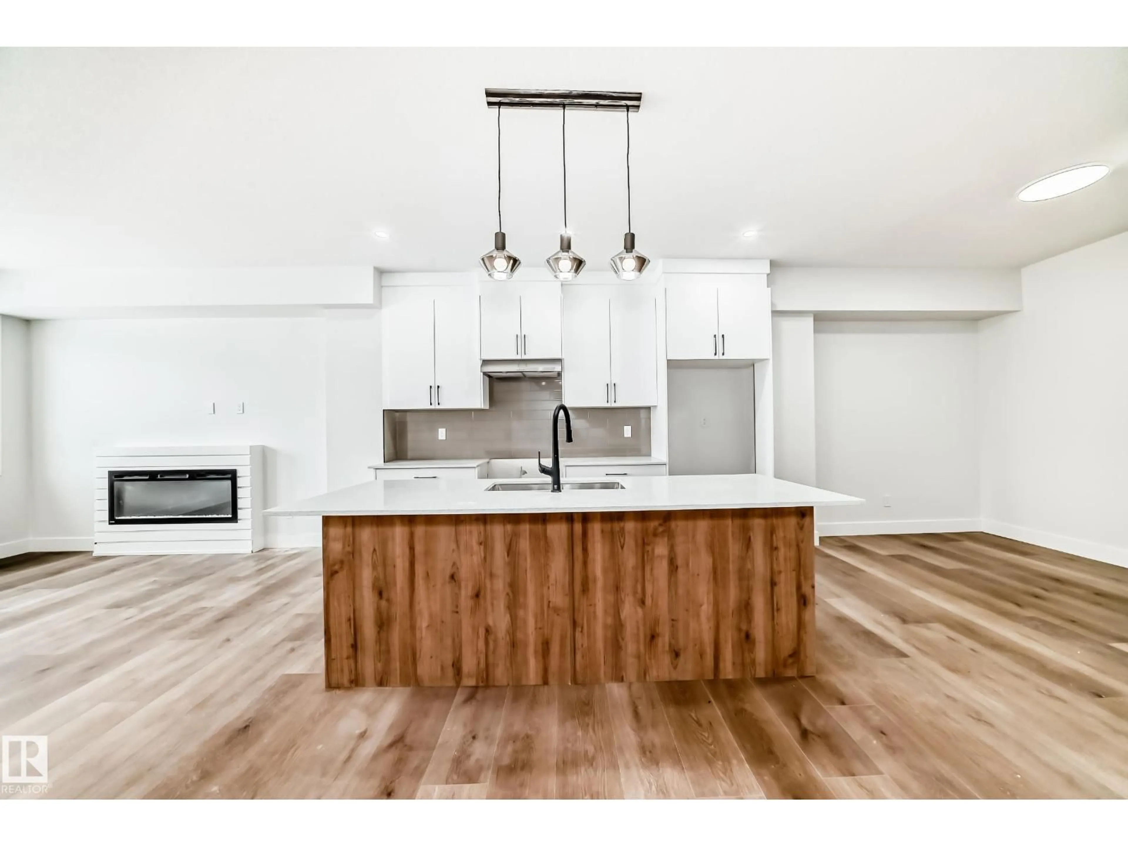 Open concept kitchen, wood/laminate floor for 66 DUVAL CR, Beaumont Alberta T4X0S6