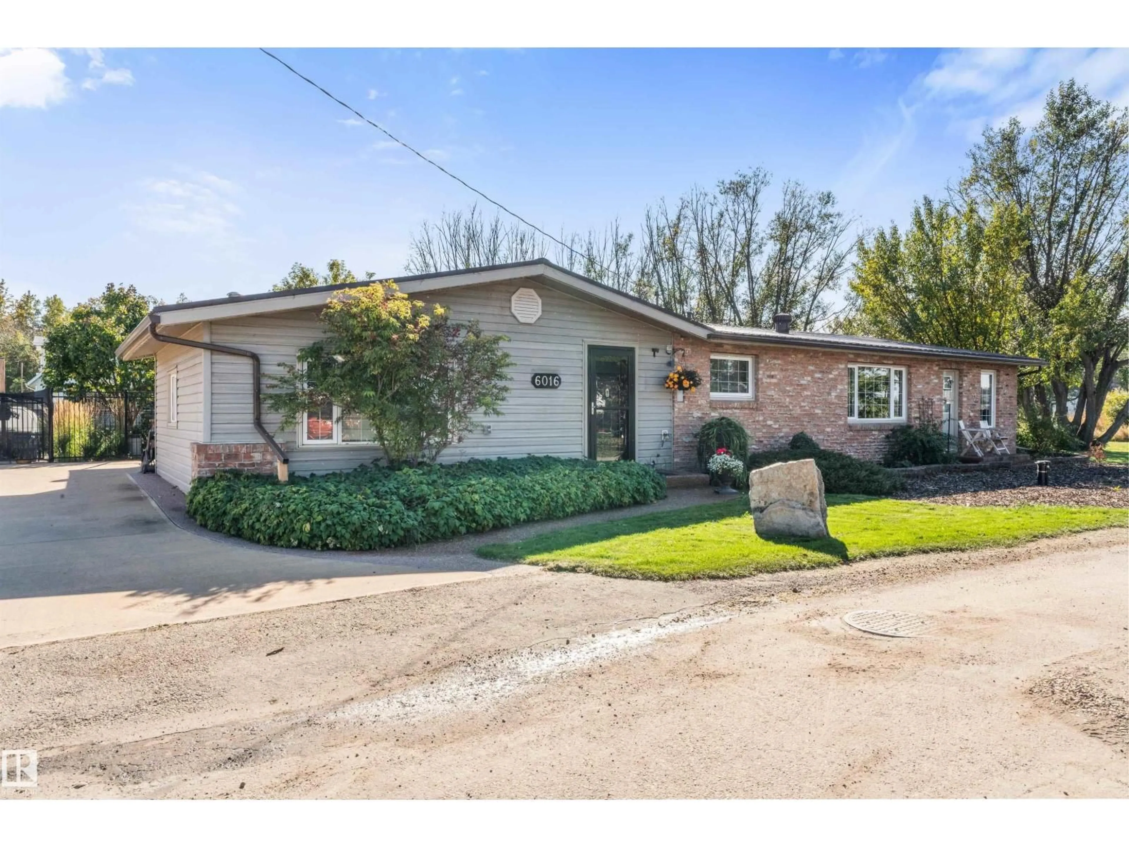 Home with brick exterior material, street for 6016 52 AV, Rural Lac Ste. Anne County Alberta T0E0A0