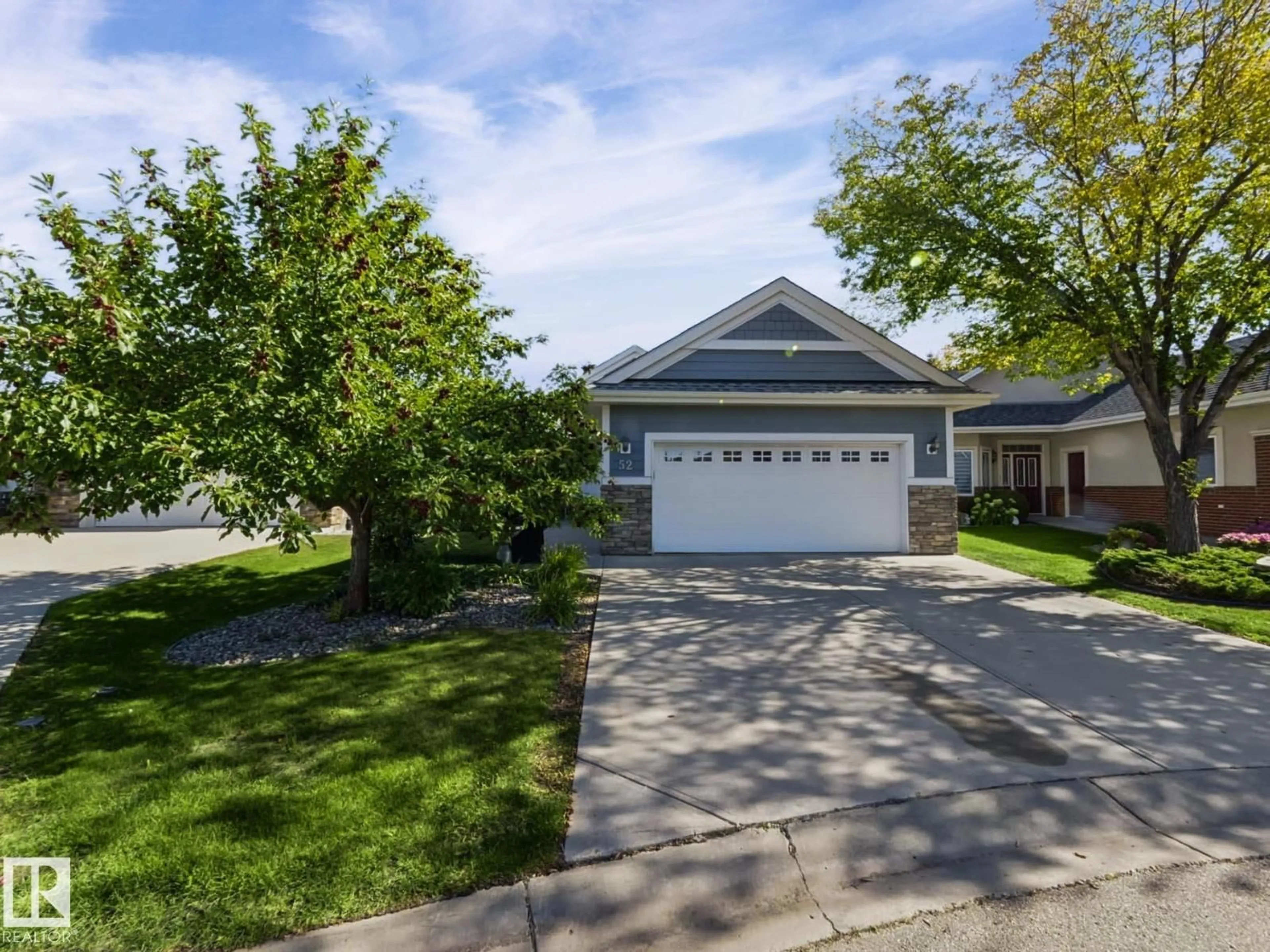 Home with vinyl exterior material, street for 18343 - 52 LESSARD RD, Edmonton Alberta T6M0A2