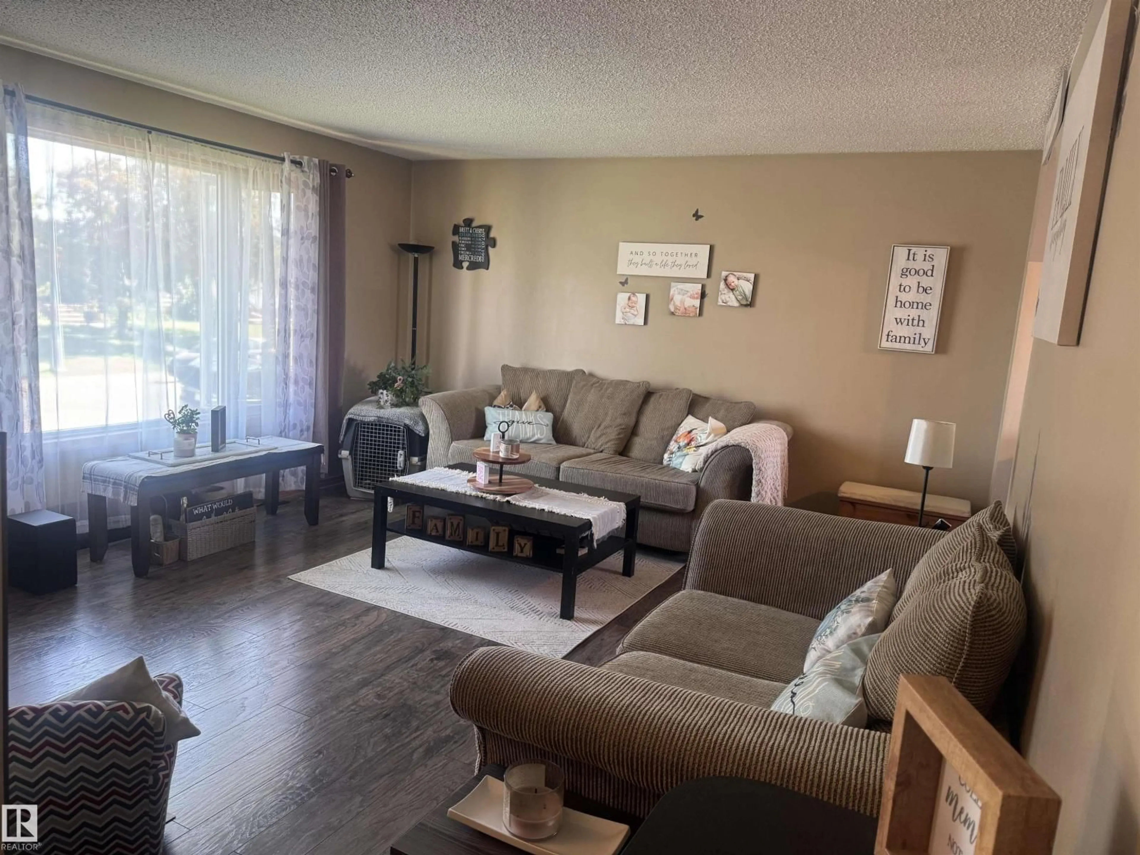 Living room with furniture, wood/laminate floor for 4104 44 ST, Stony Plain Alberta T7Z1J6