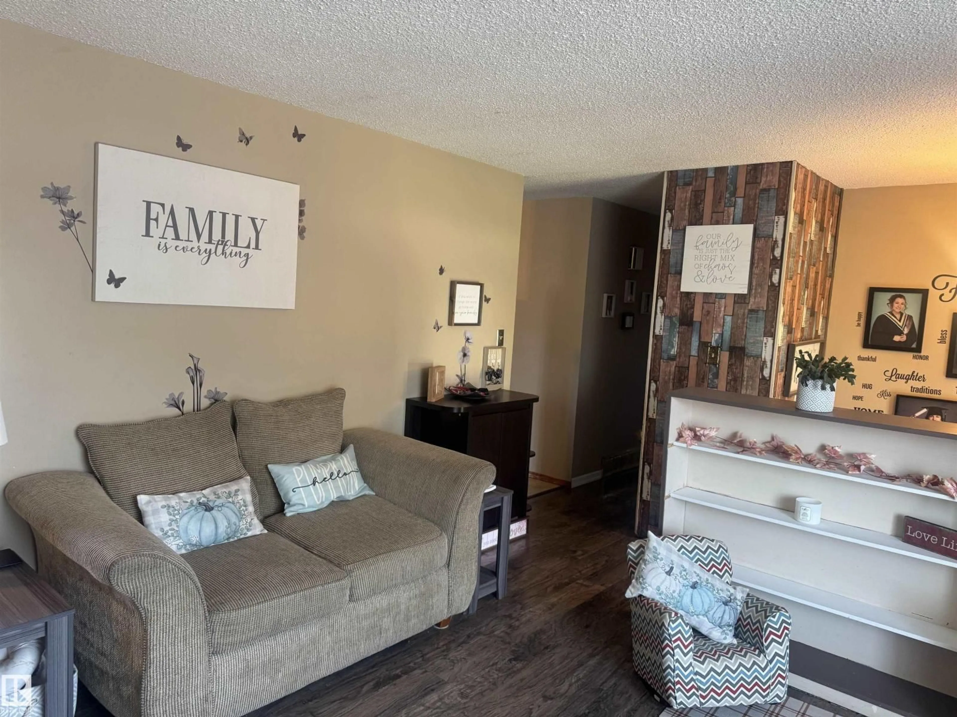Living room with furniture, wood/laminate floor for 4104 44 ST, Stony Plain Alberta T7Z1J6