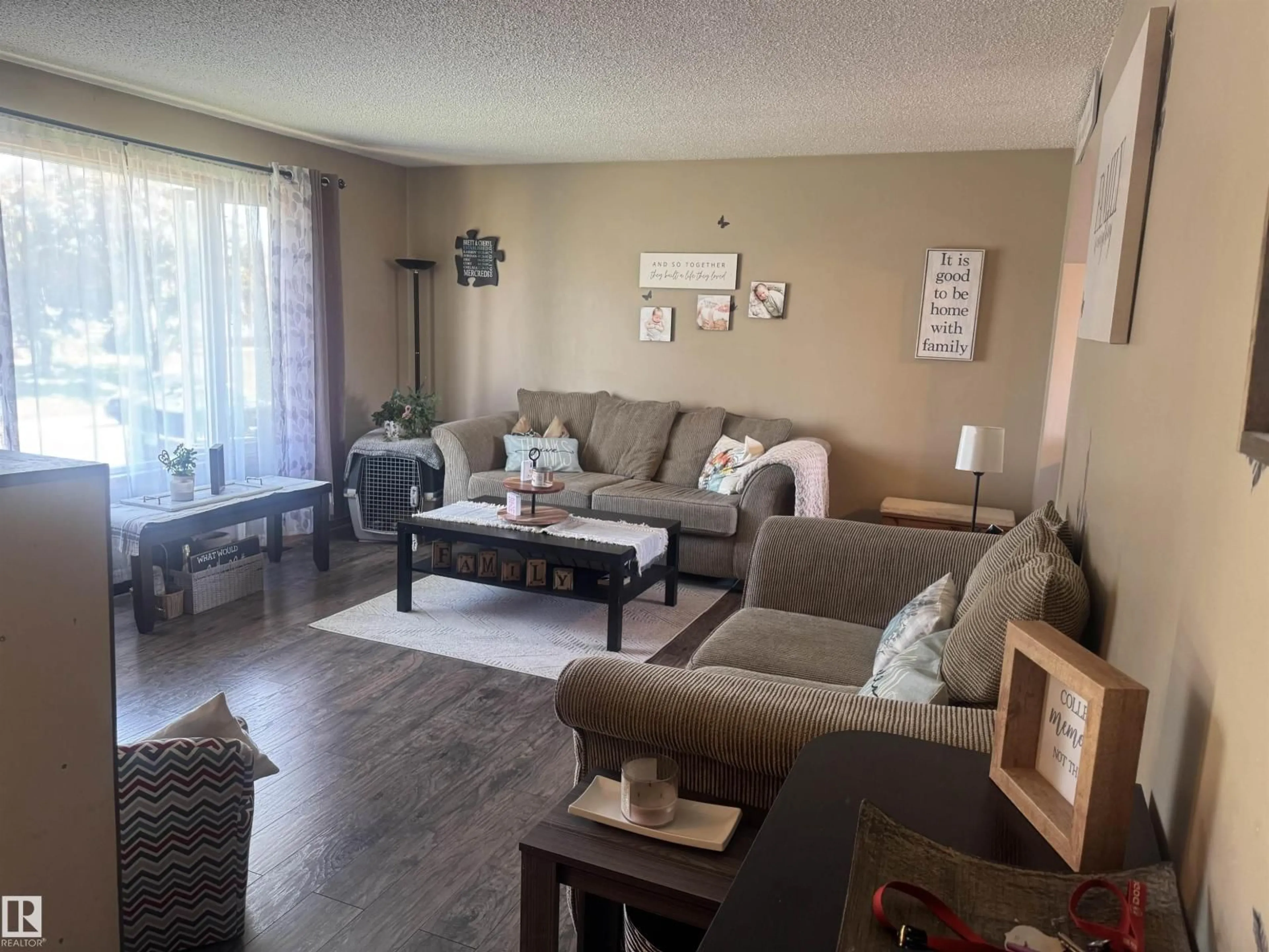 Living room with furniture, wood/laminate floor for 4104 44 ST, Stony Plain Alberta T7Z1J6