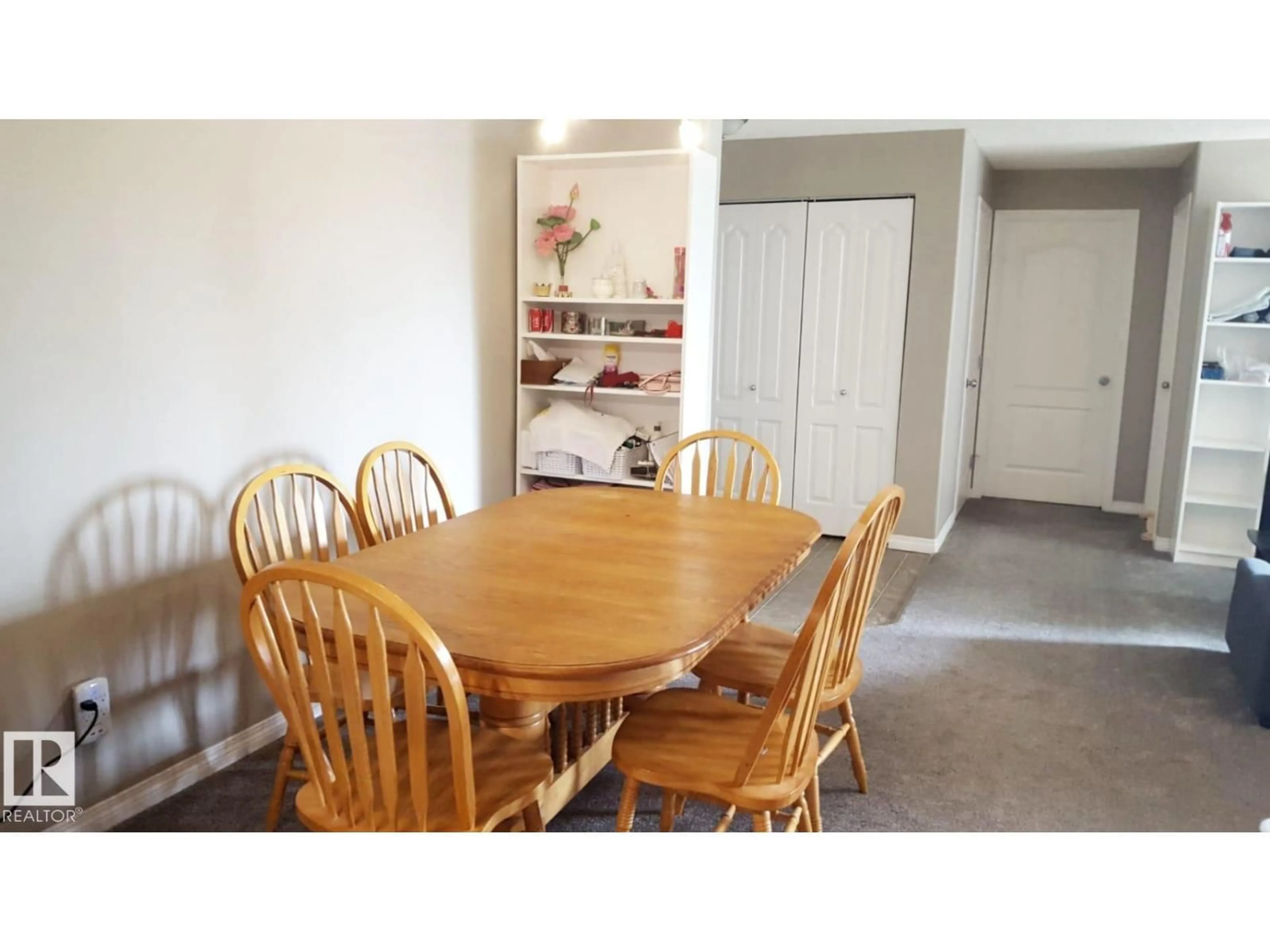 Dining room, wood/laminate floor for 331 - 3425 19 ST, Edmonton Alberta T6T2B5