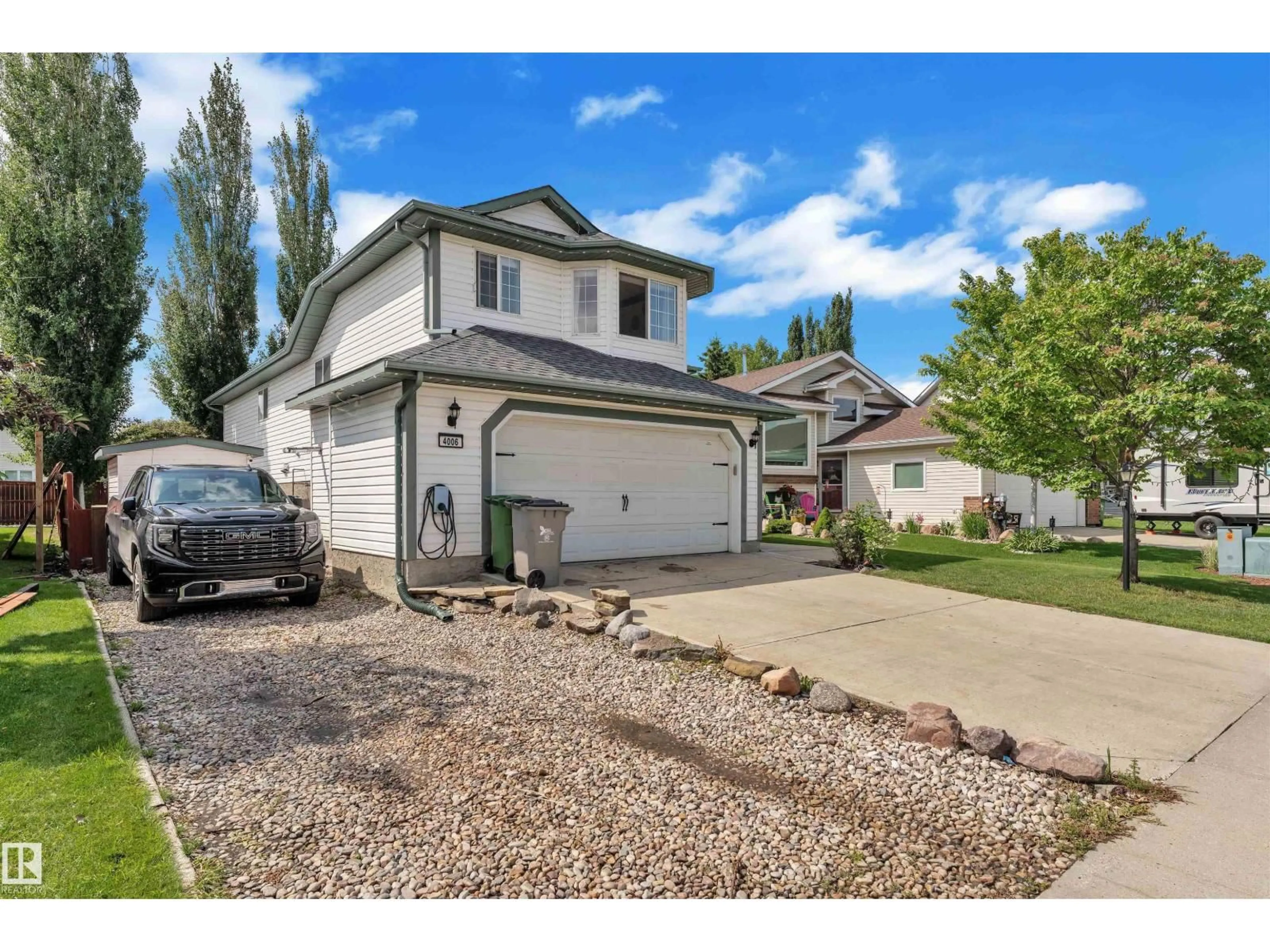 Home with vinyl exterior material, street for 4006 53, Beaumont Alberta T4X1N4