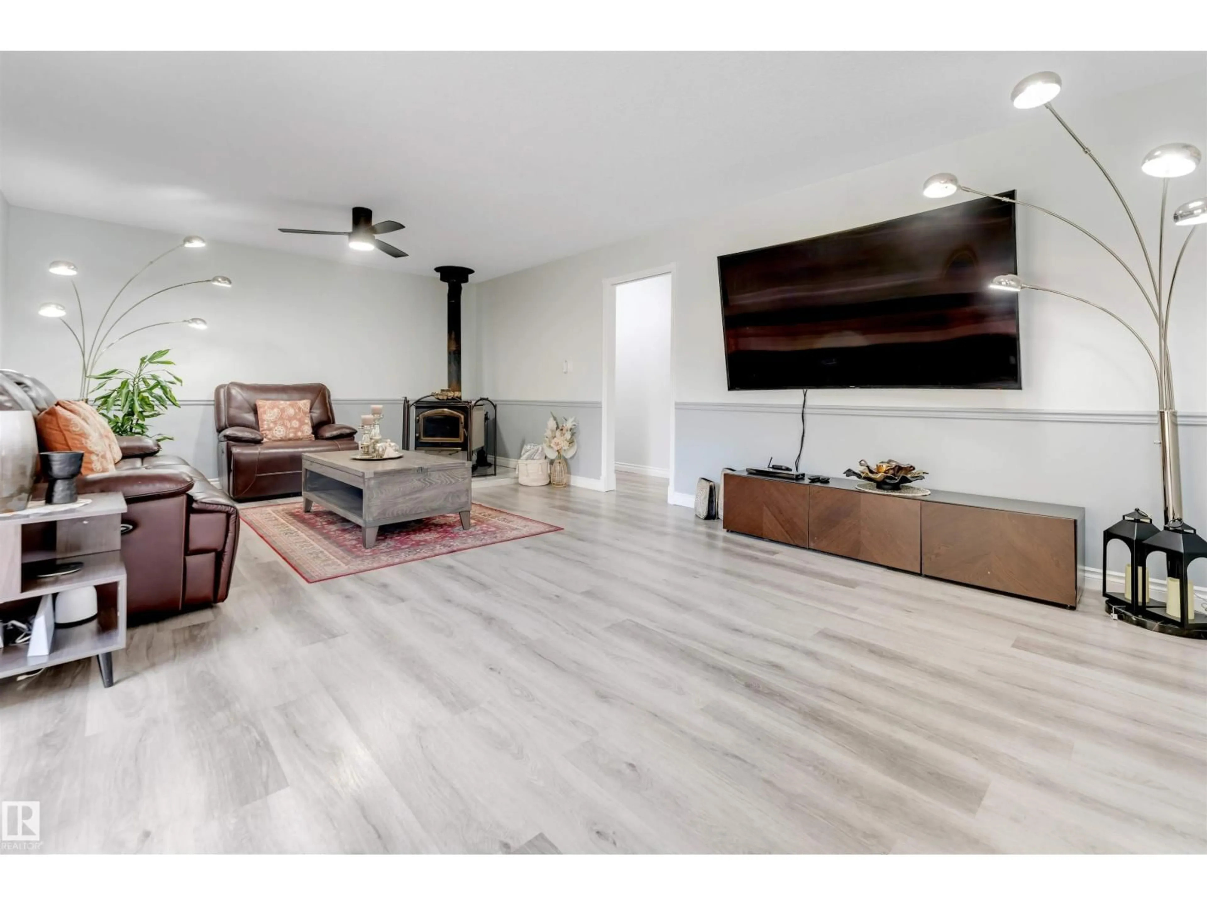 Living room with furniture, wood/laminate floor for #37 - 23020 TOWNSHIP ROAD RD, Rural Strathcona County Alberta T8B1H1