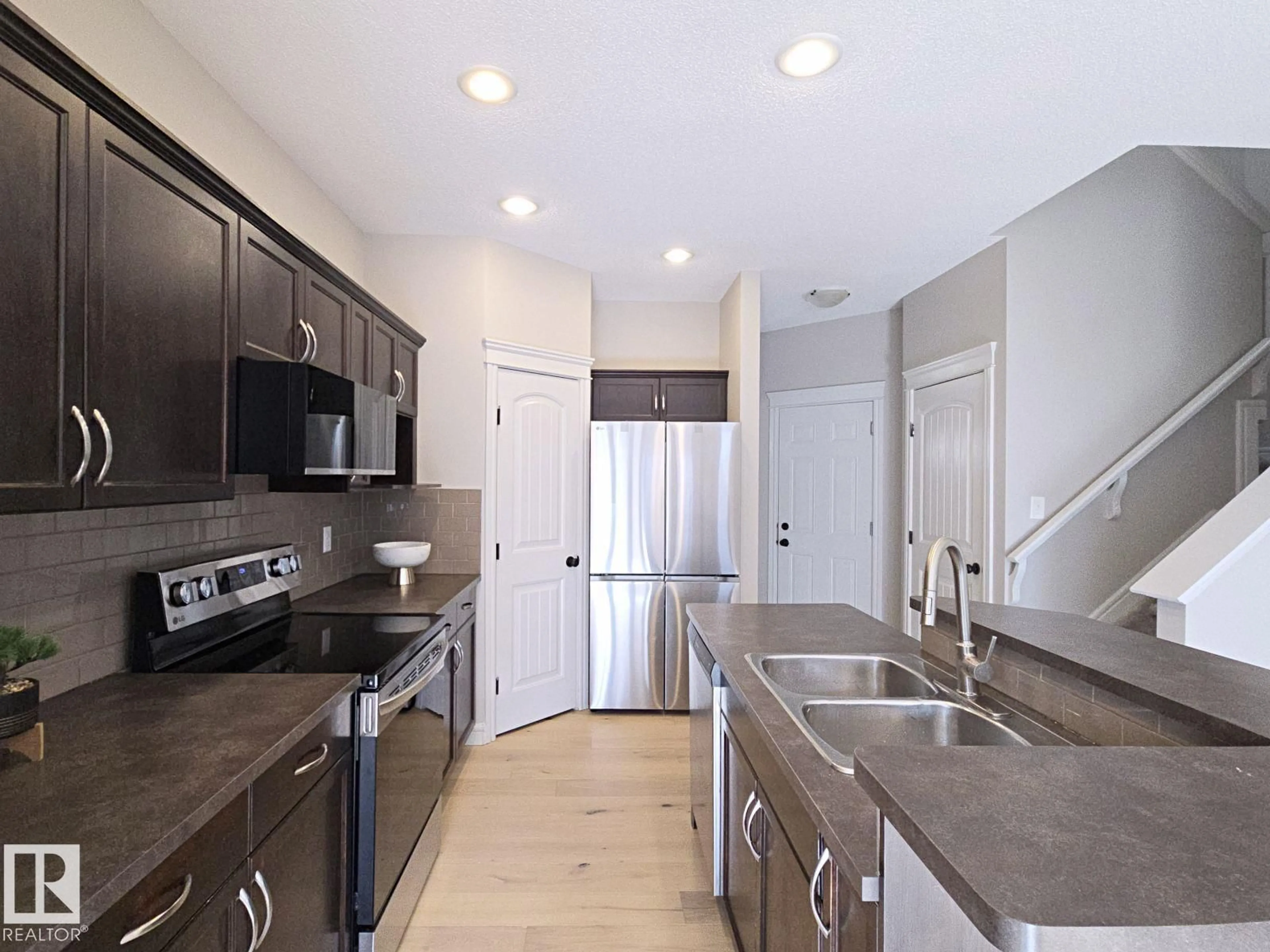 Open concept kitchen, ceramic/tile floor for 11525 18A AV, Edmonton Alberta T6W2E6