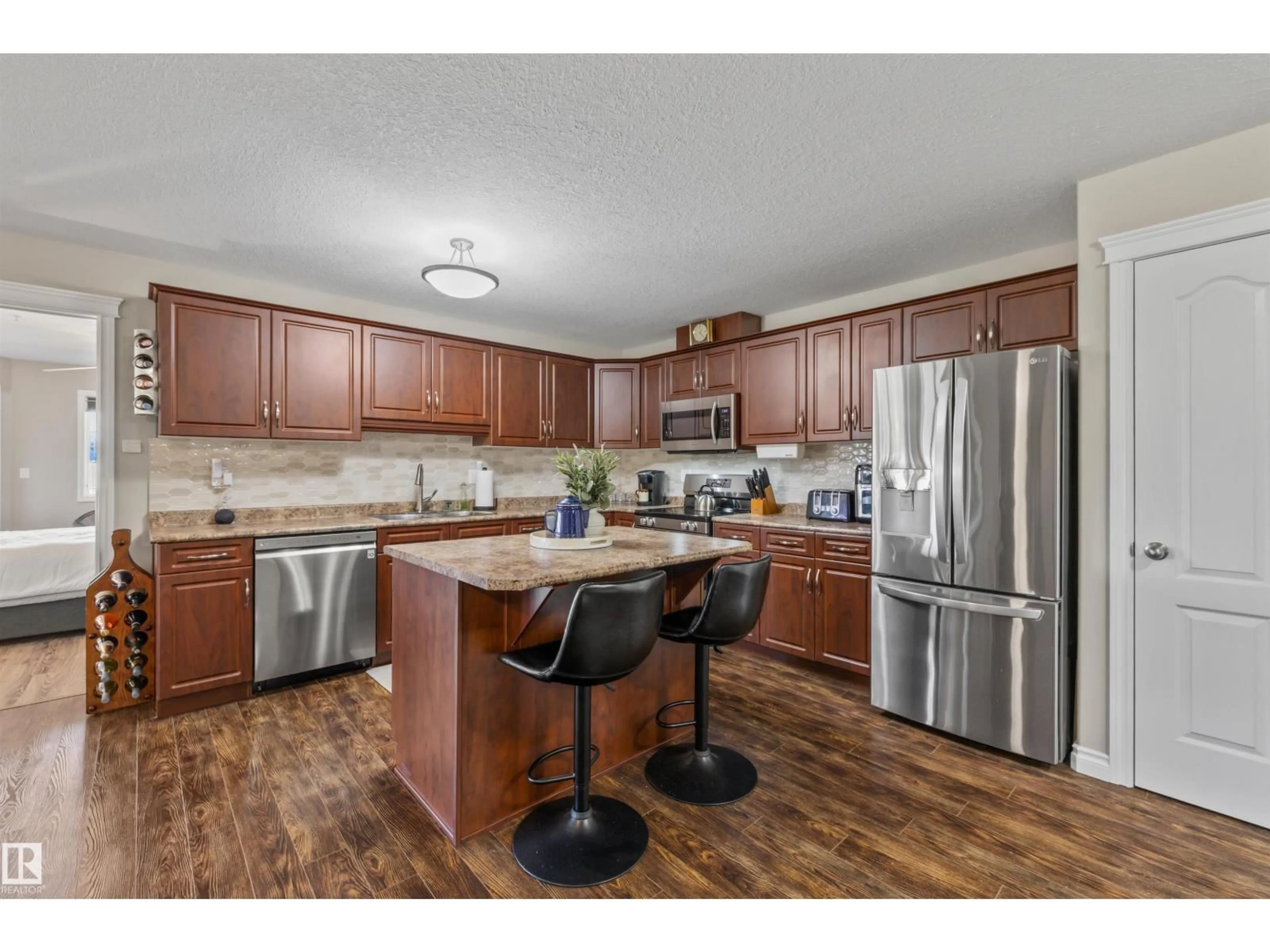 Open concept kitchen, wood/laminate floor for 332 WESTERRA MR, Stony Plain Alberta T7Z0G7