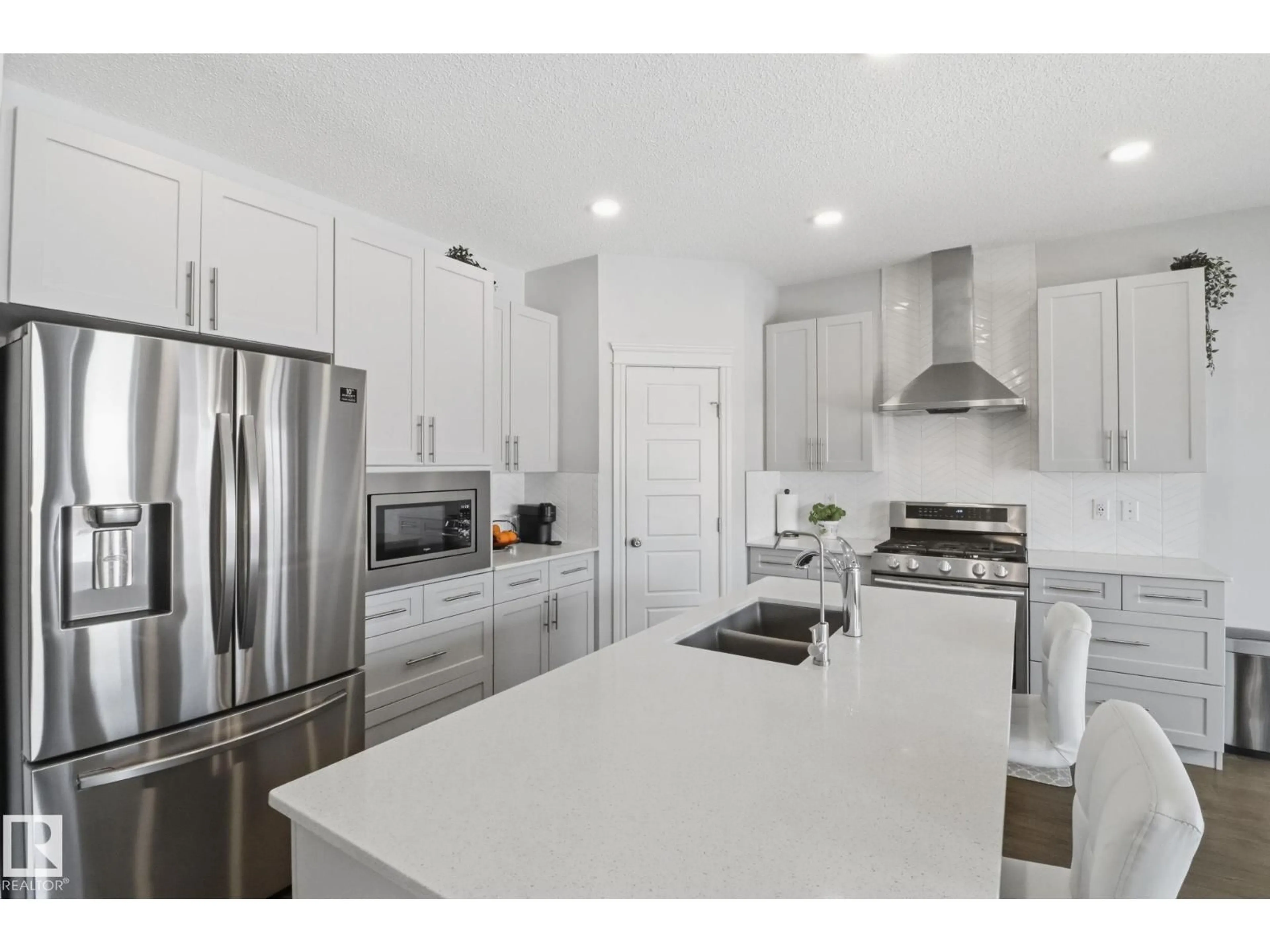 Open concept kitchen, ceramic/tile floor for 812 176 ST, Edmonton Alberta T6W2X3