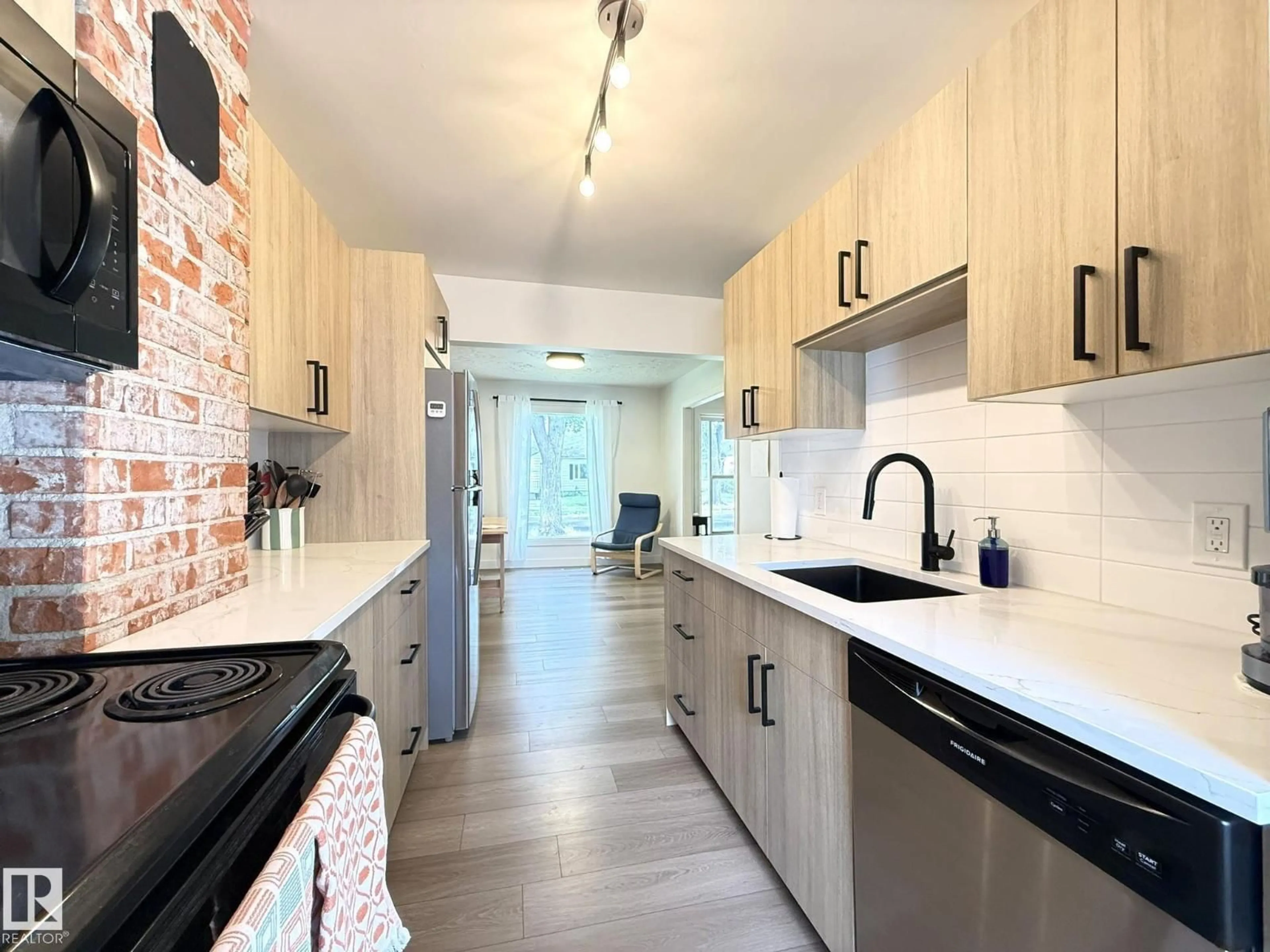 Open concept kitchen, ceramic/tile floor for 11416 90 ST, Edmonton Alberta T5B3X7