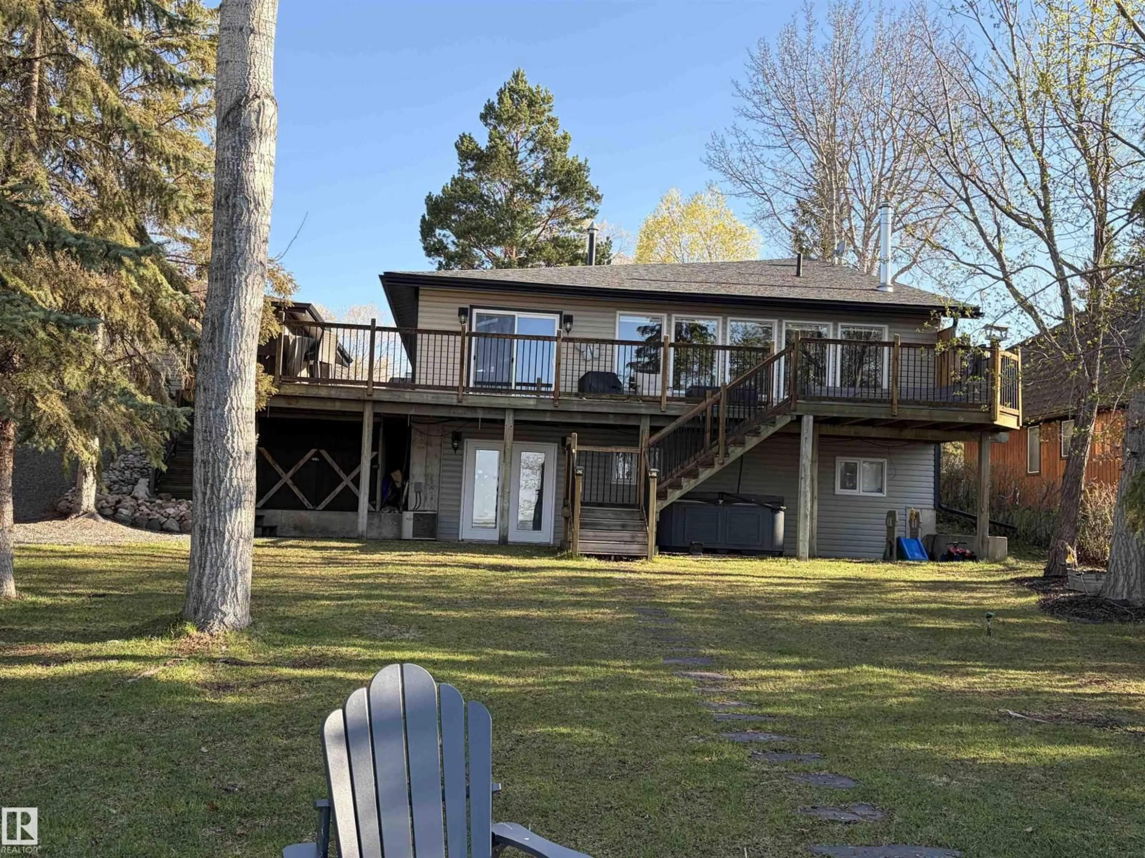 A pic from outside/outdoor area/front of a property/back of a property/a pic from drone, water/lake/river/ocean view for #417 - 61314 RR 463, Rural Bonnyville M.D. Alberta T9N2H9