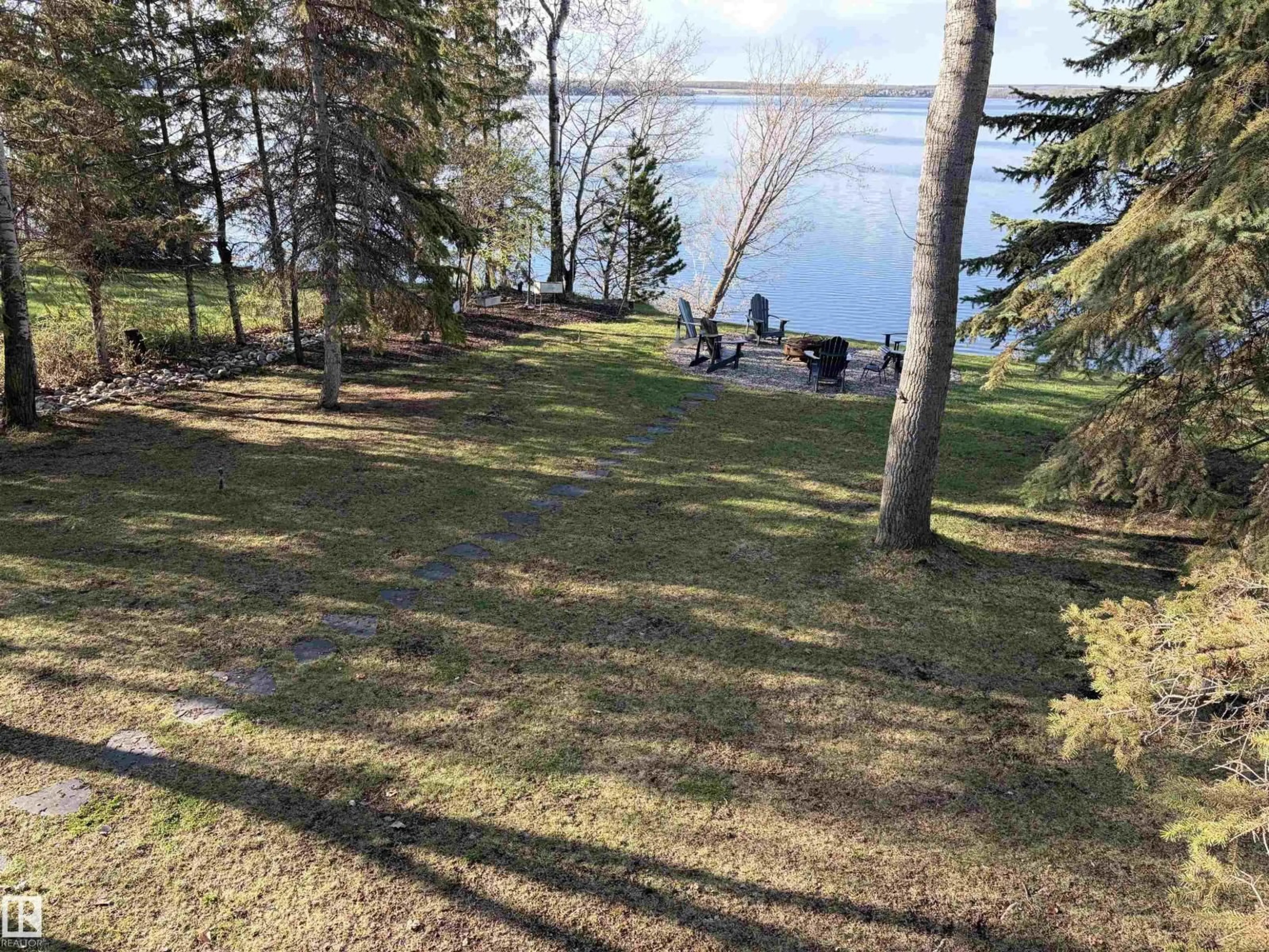 A pic from outside/outdoor area/front of a property/back of a property/a pic from drone, water/lake/river/ocean view for #417 - 61314 RR 463, Rural Bonnyville M.D. Alberta T9N2H9