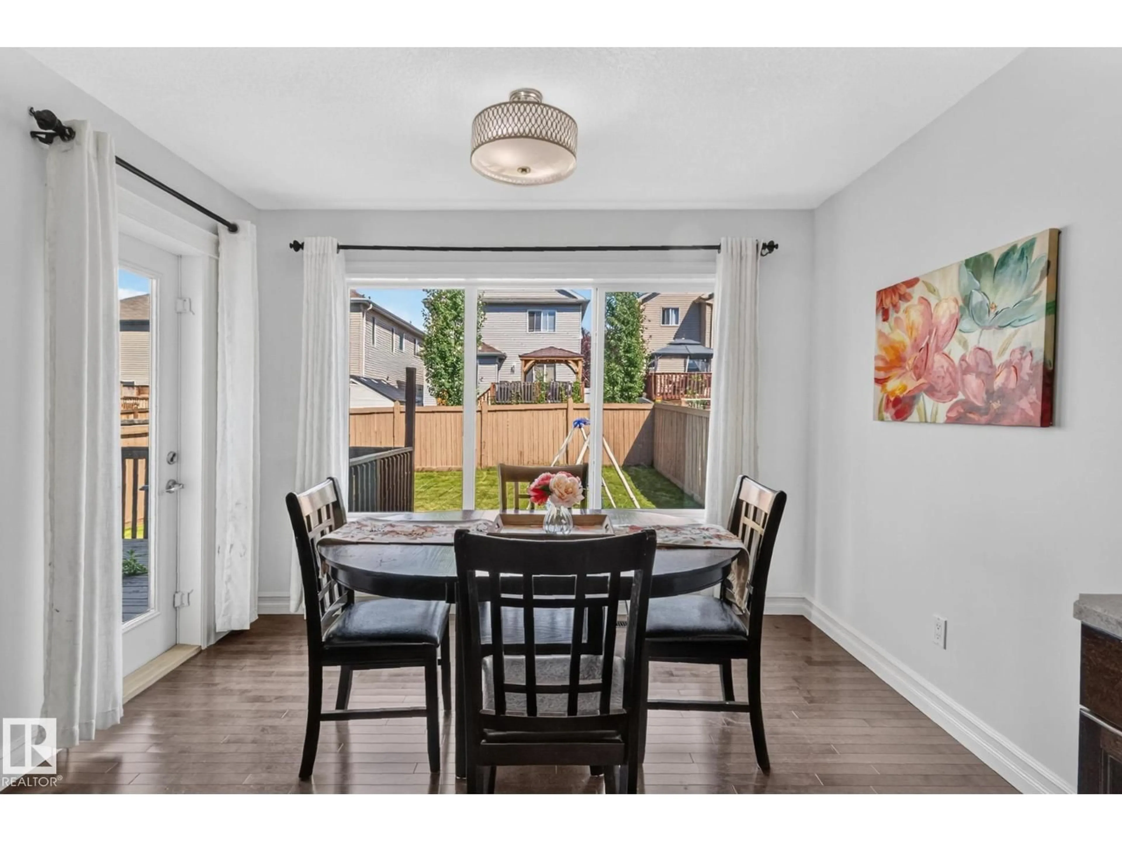 Dining room, wood/laminate floor for SW - 1115 61 ST, Edmonton Alberta T6X0M5