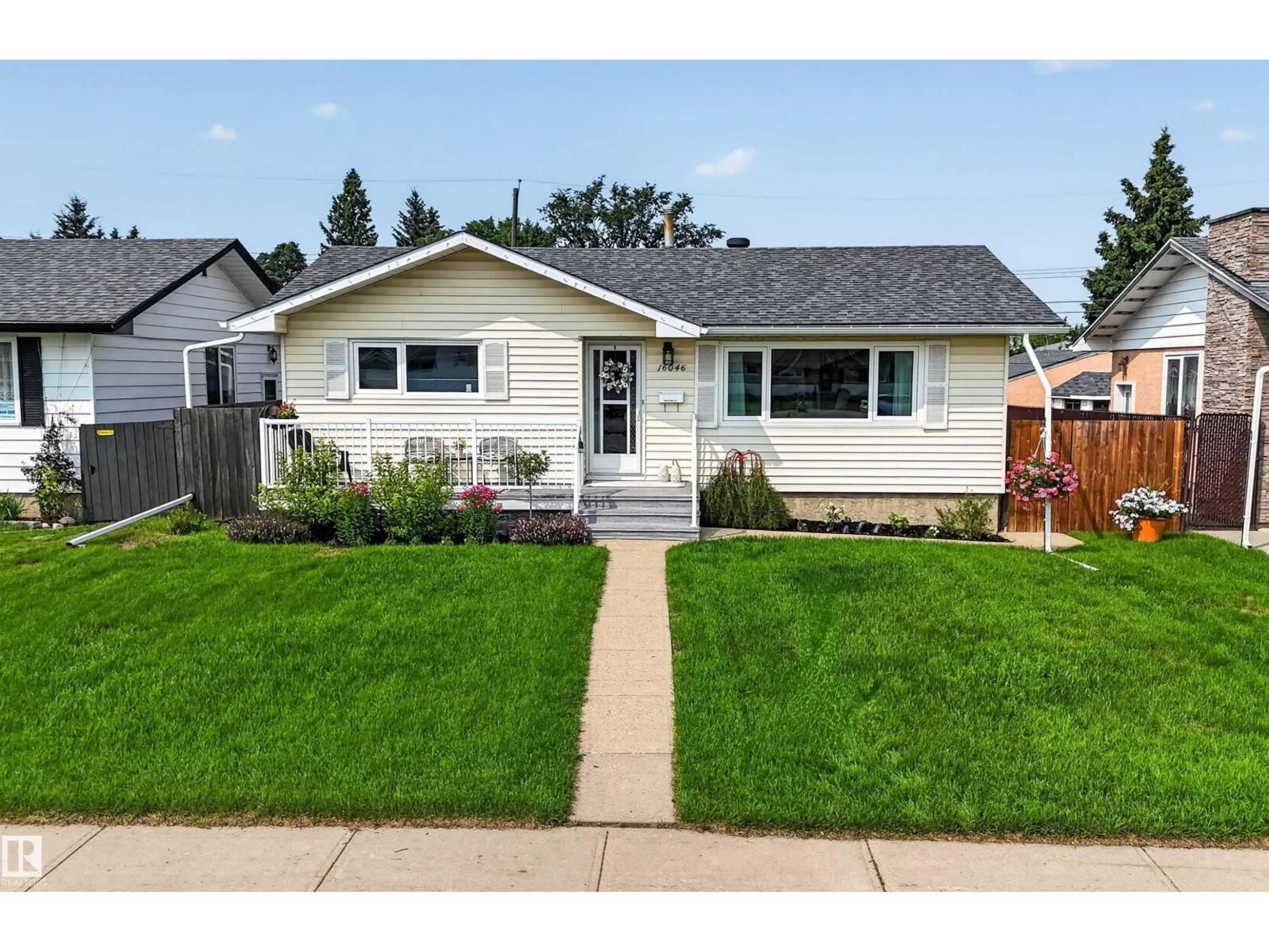 Home with vinyl exterior material, street for 16046 95 AV, Edmonton Alberta T5P0A7