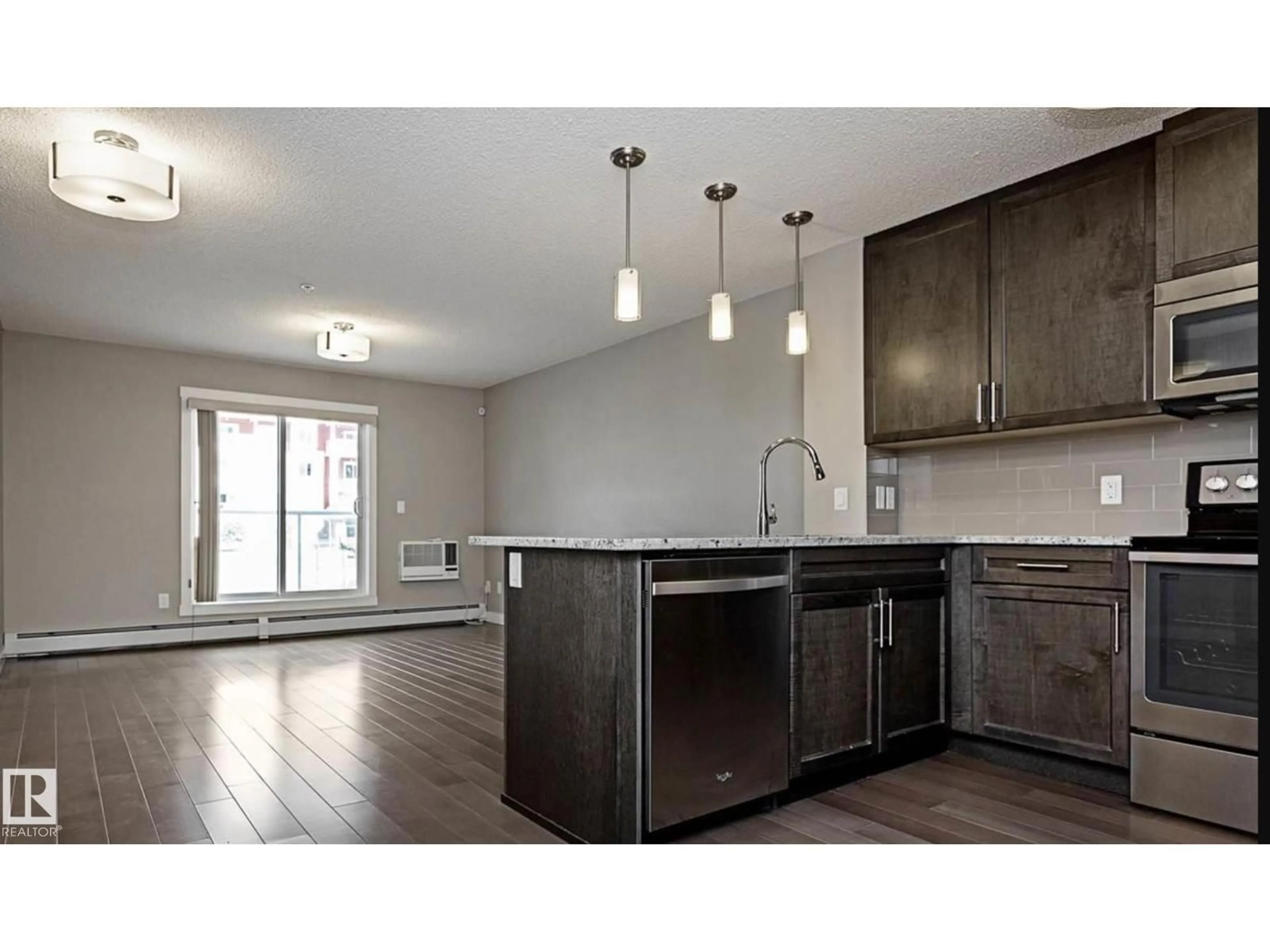 Open concept kitchen, wood/laminate floor for 109 - 2207 44 AV NW, Edmonton Alberta T6T0T2