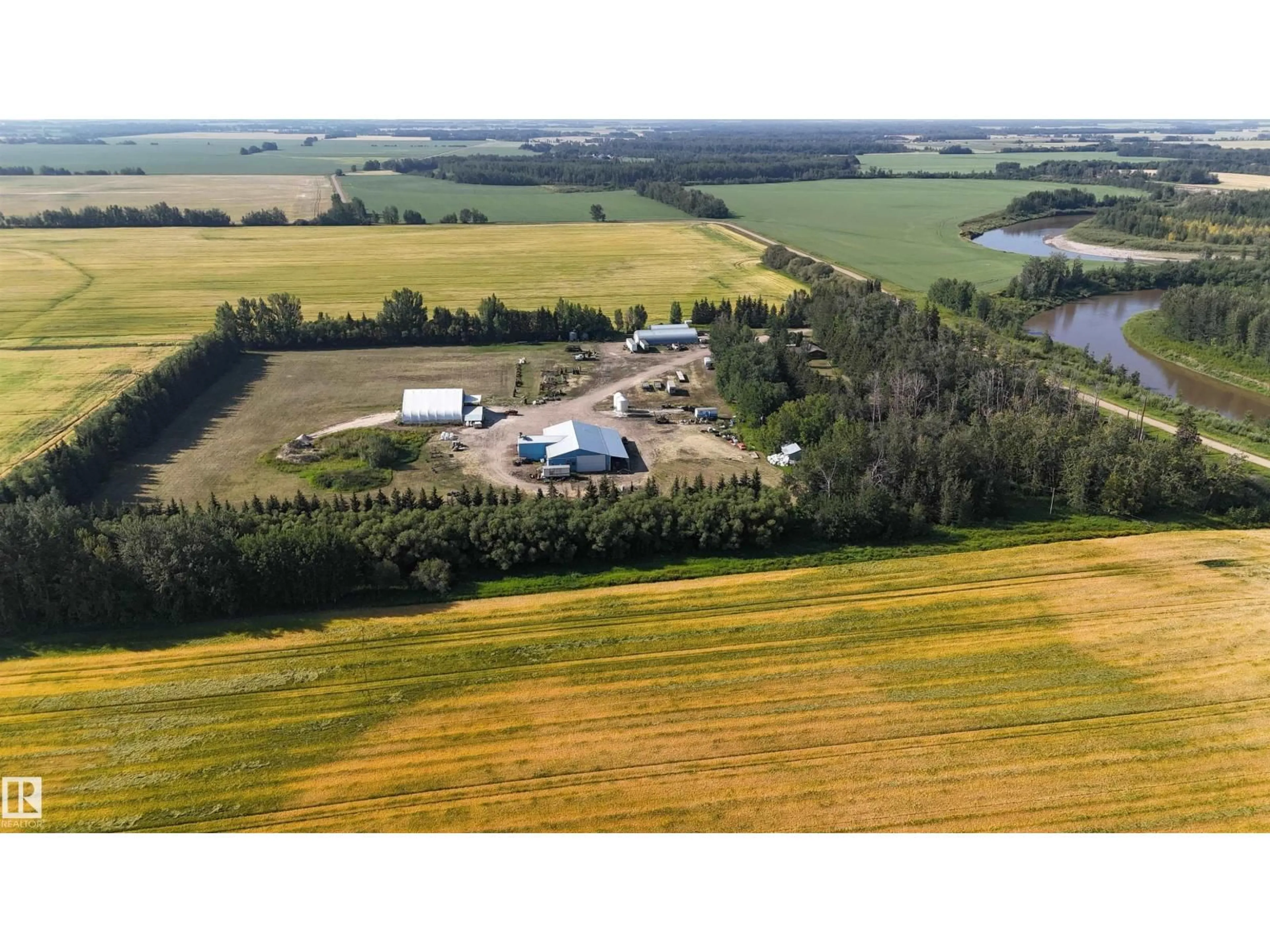 A pic from outside/outdoor area/front of a property/back of a property/a pic from drone, water/lake/river/ocean view for 61411 RGE ROAD 272, Rural Westlock County Alberta T7P2P4