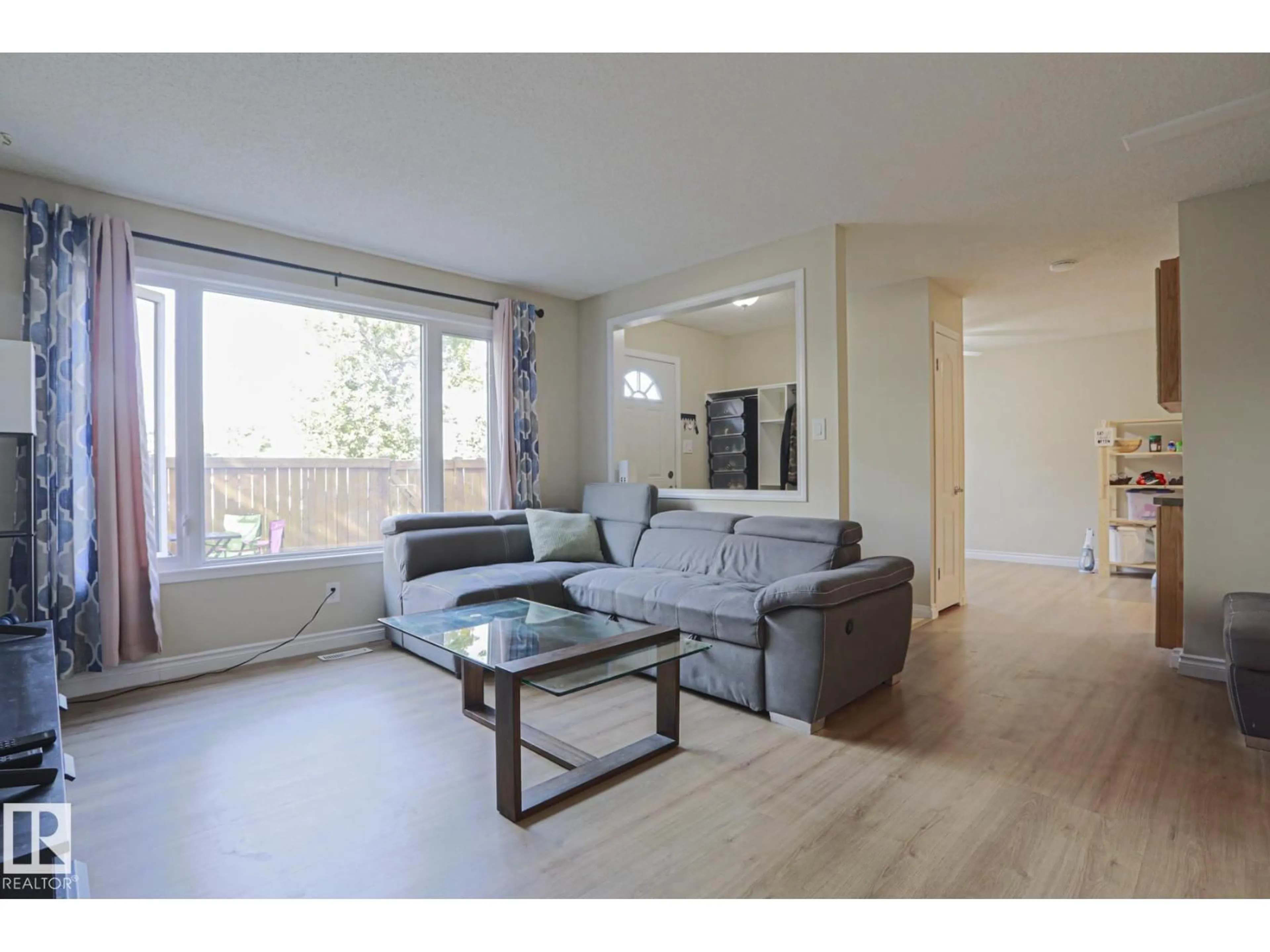 Living room with furniture, wood/laminate floor for 319 TELFORD CO, Leduc Alberta T9E5N2