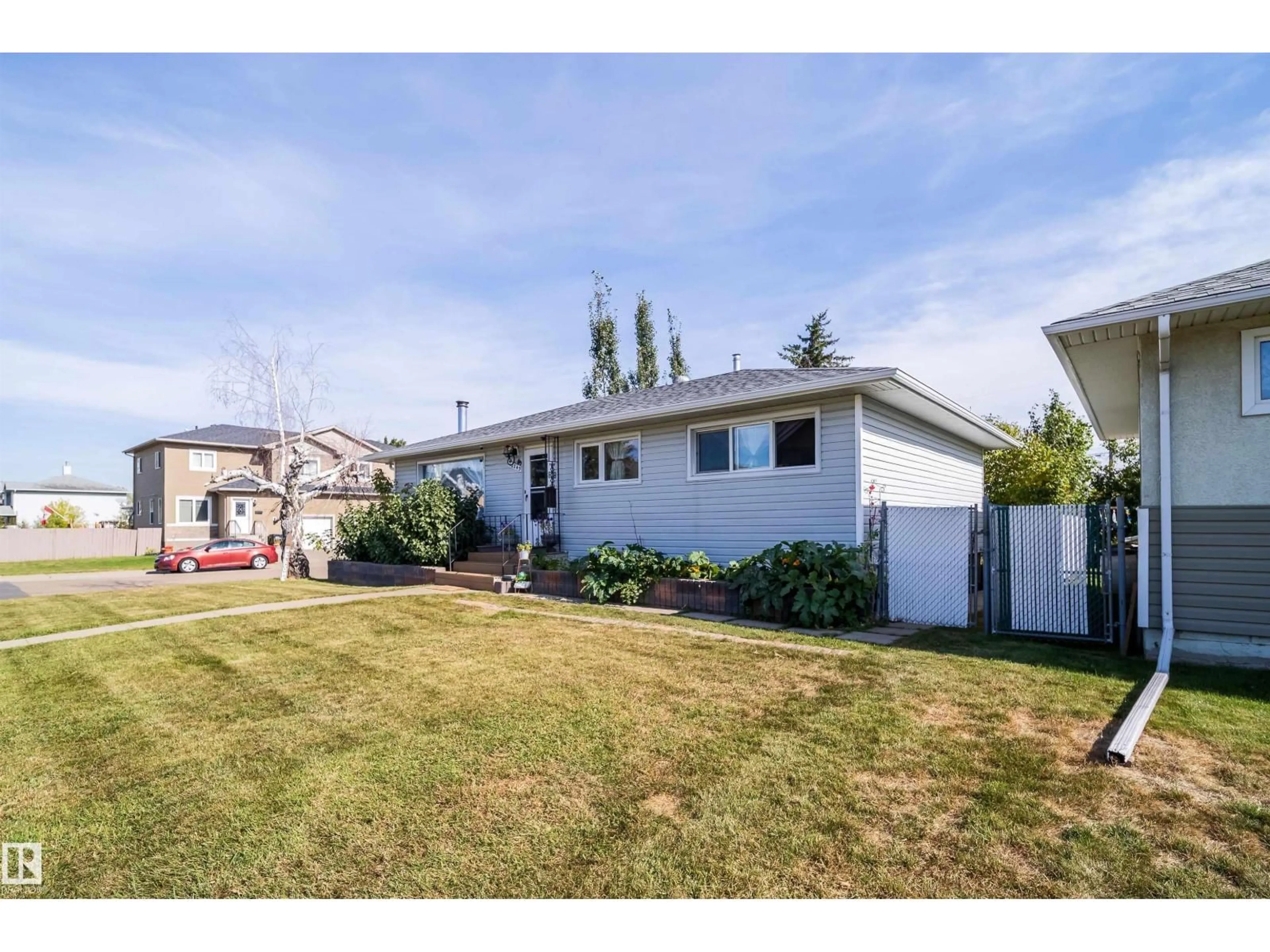 Home with vinyl exterior material, street for 10245 160 ST NW, Edmonton Alberta T5P3G1