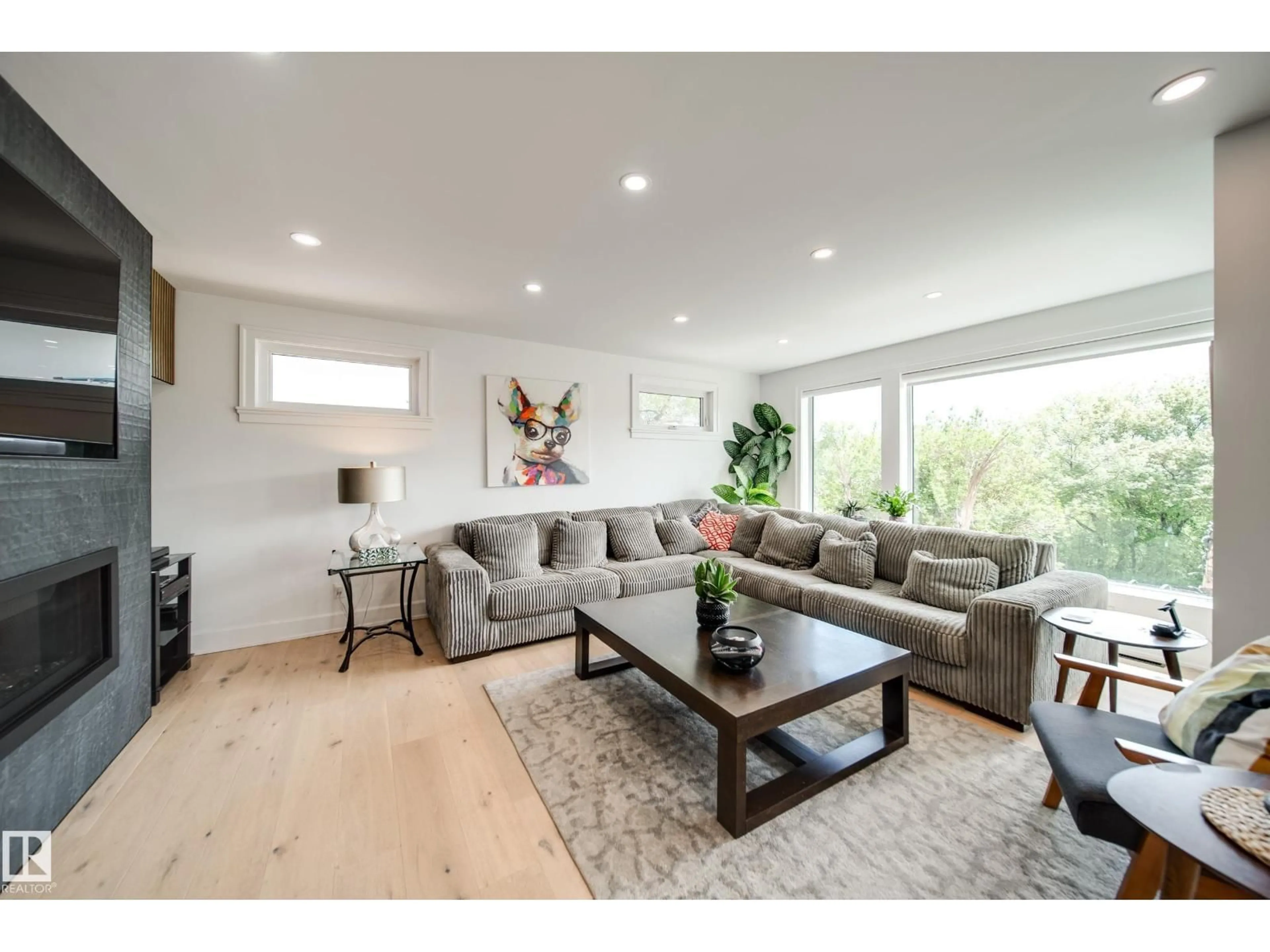 Living room with furniture, wood/laminate floor for 5310 ADA BV, Edmonton Alberta T5W4N7
