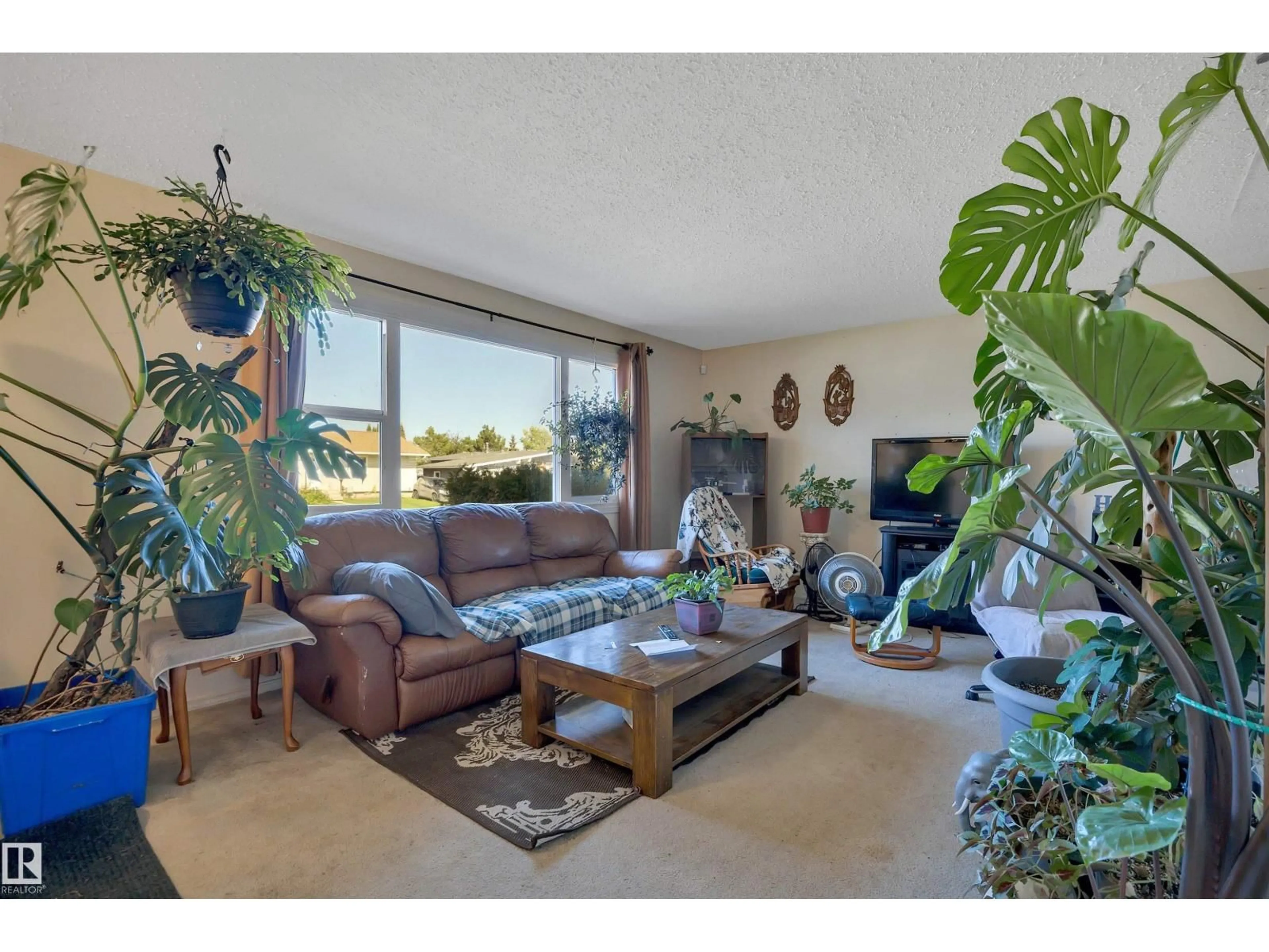 Living room with furniture, unknown for 4205 37 AV, Leduc Alberta T9E6A5