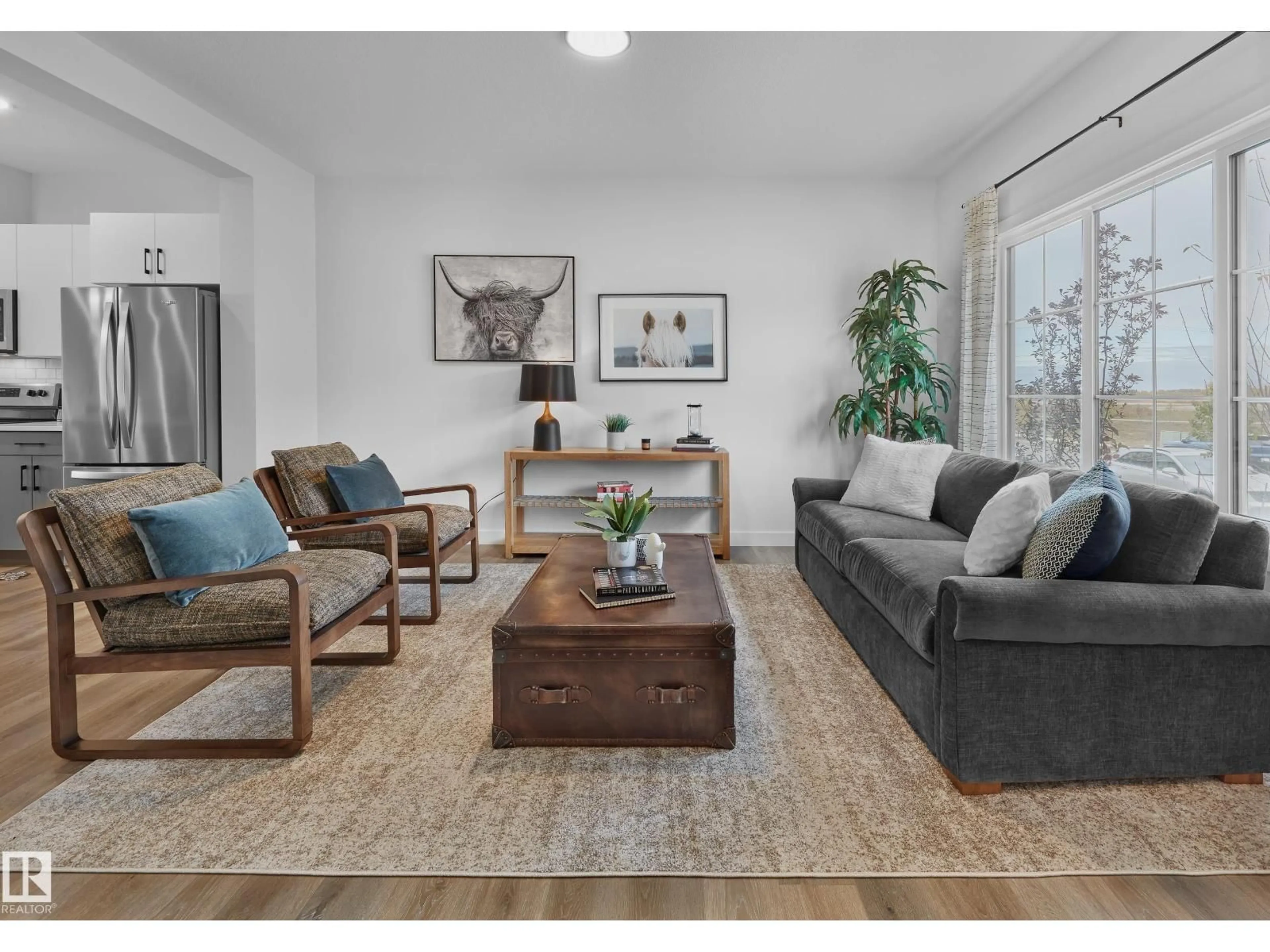 Living room with furniture, wood/laminate floor for 129 CHELLES WD, St. Albert Alberta T8T2C2
