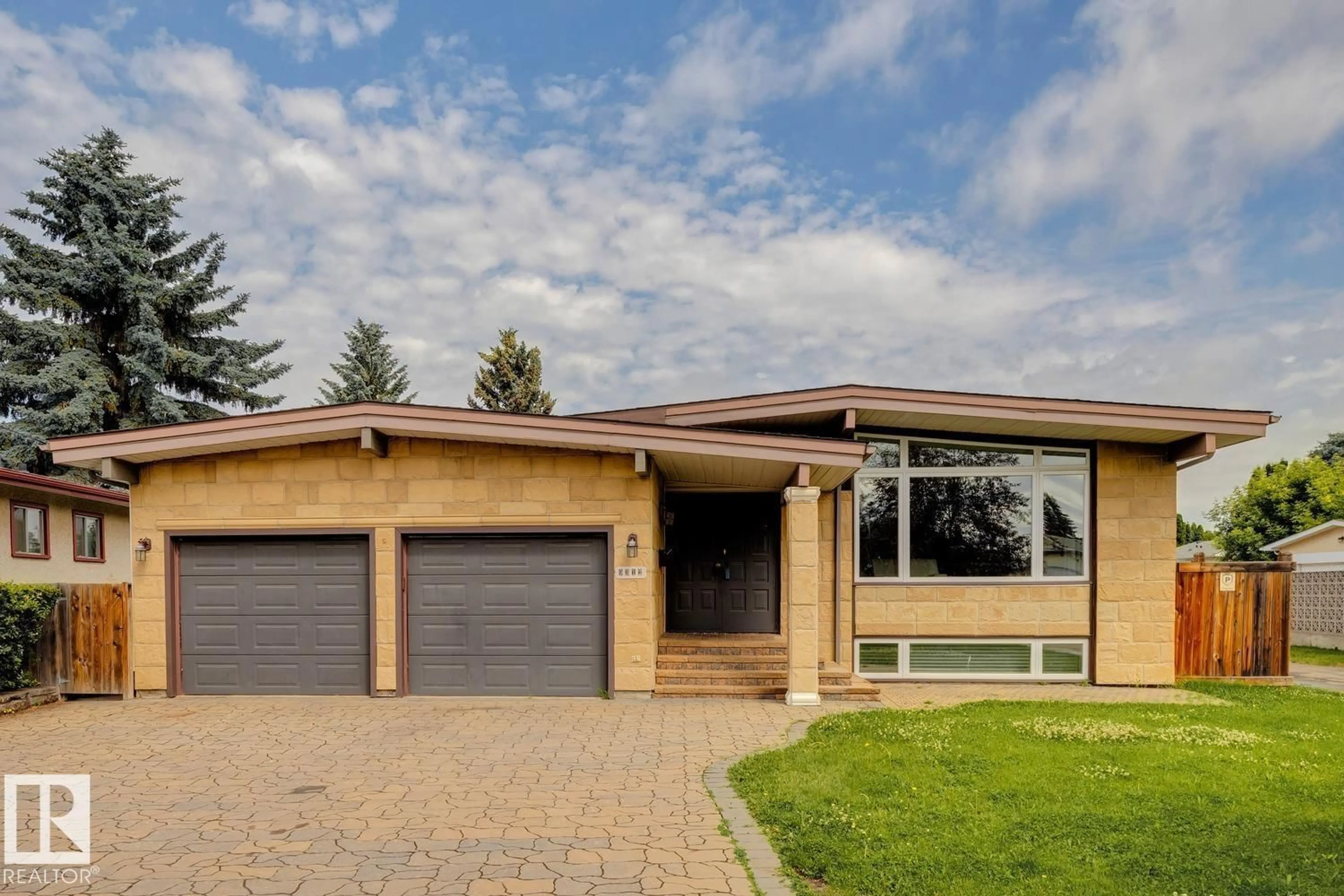 Home with brick exterior material, street for NW - 9312 151 AV, Edmonton Alberta T5E2P9