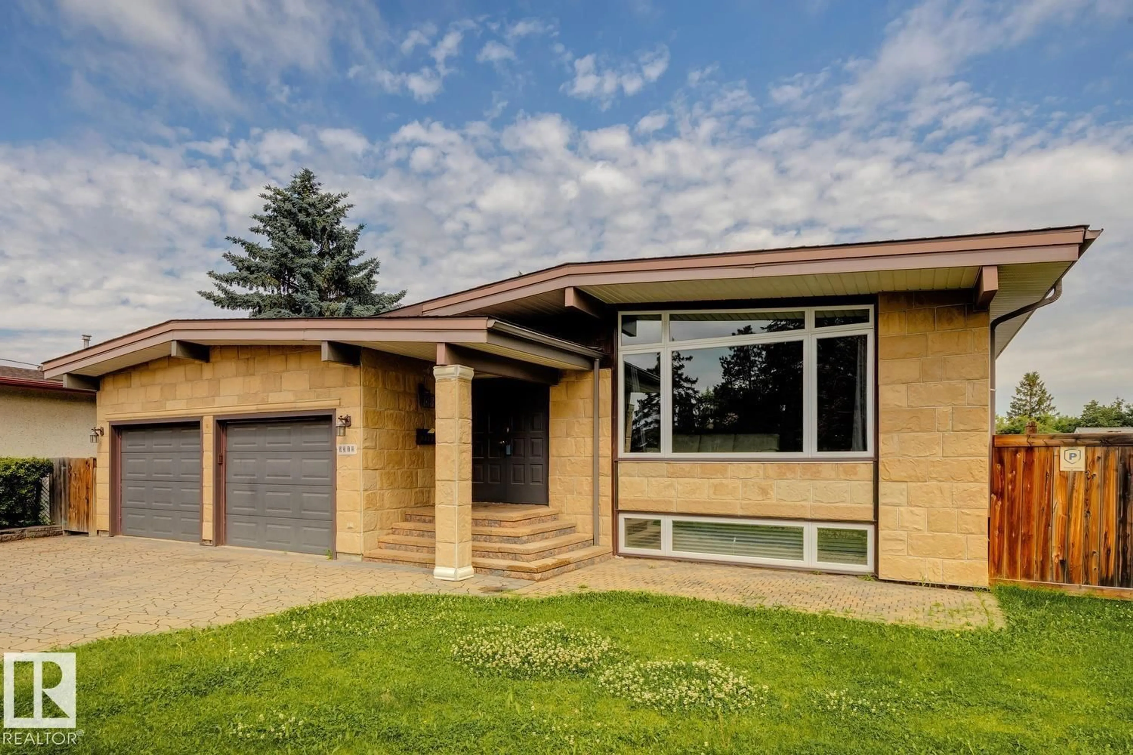 Home with brick exterior material, street for NW - 9312 151 AV, Edmonton Alberta T5E2P9