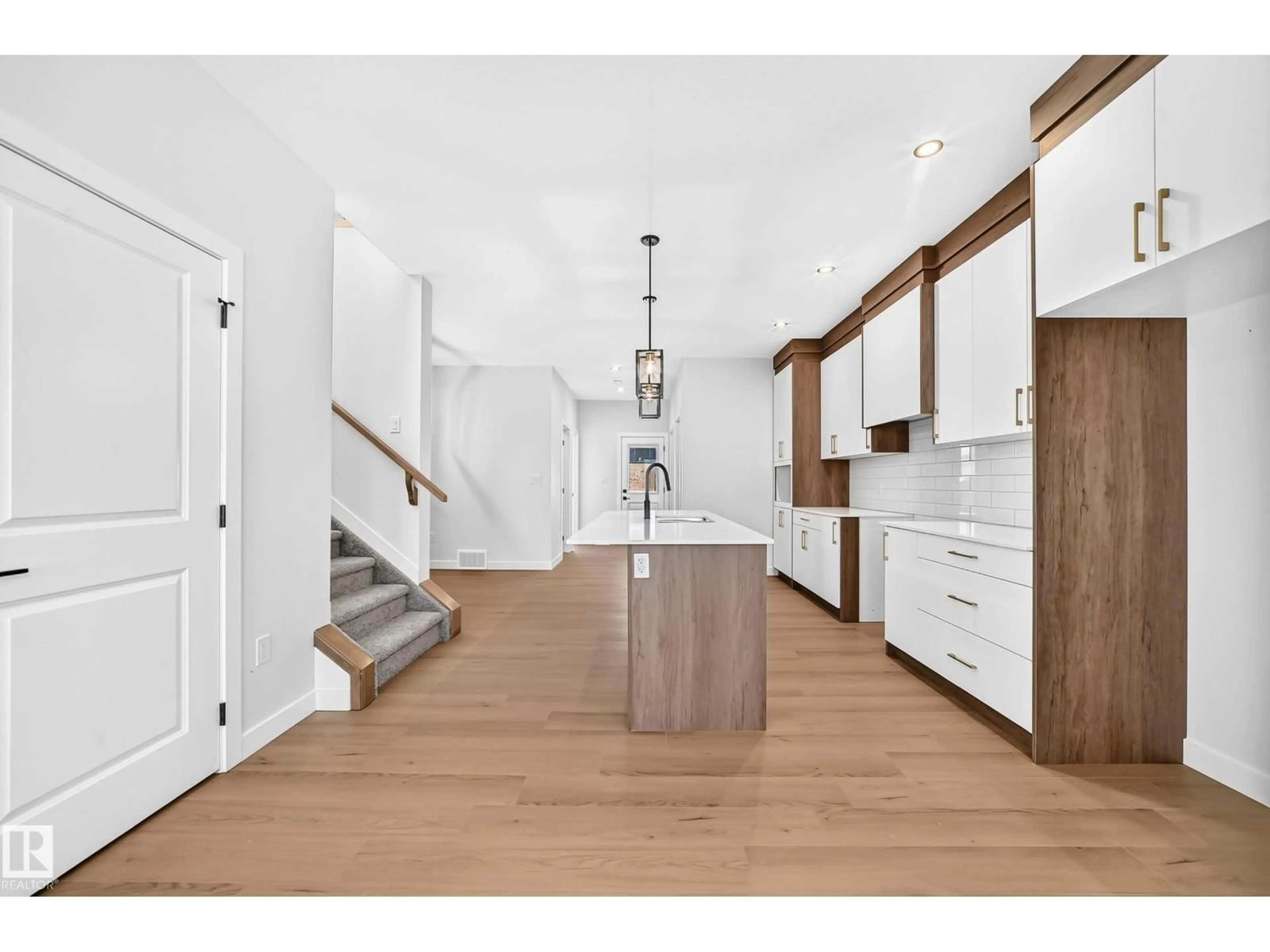 Open concept kitchen, wood/laminate floor for 9 TILIA PL, Spruce Grove Alberta T7X4S9