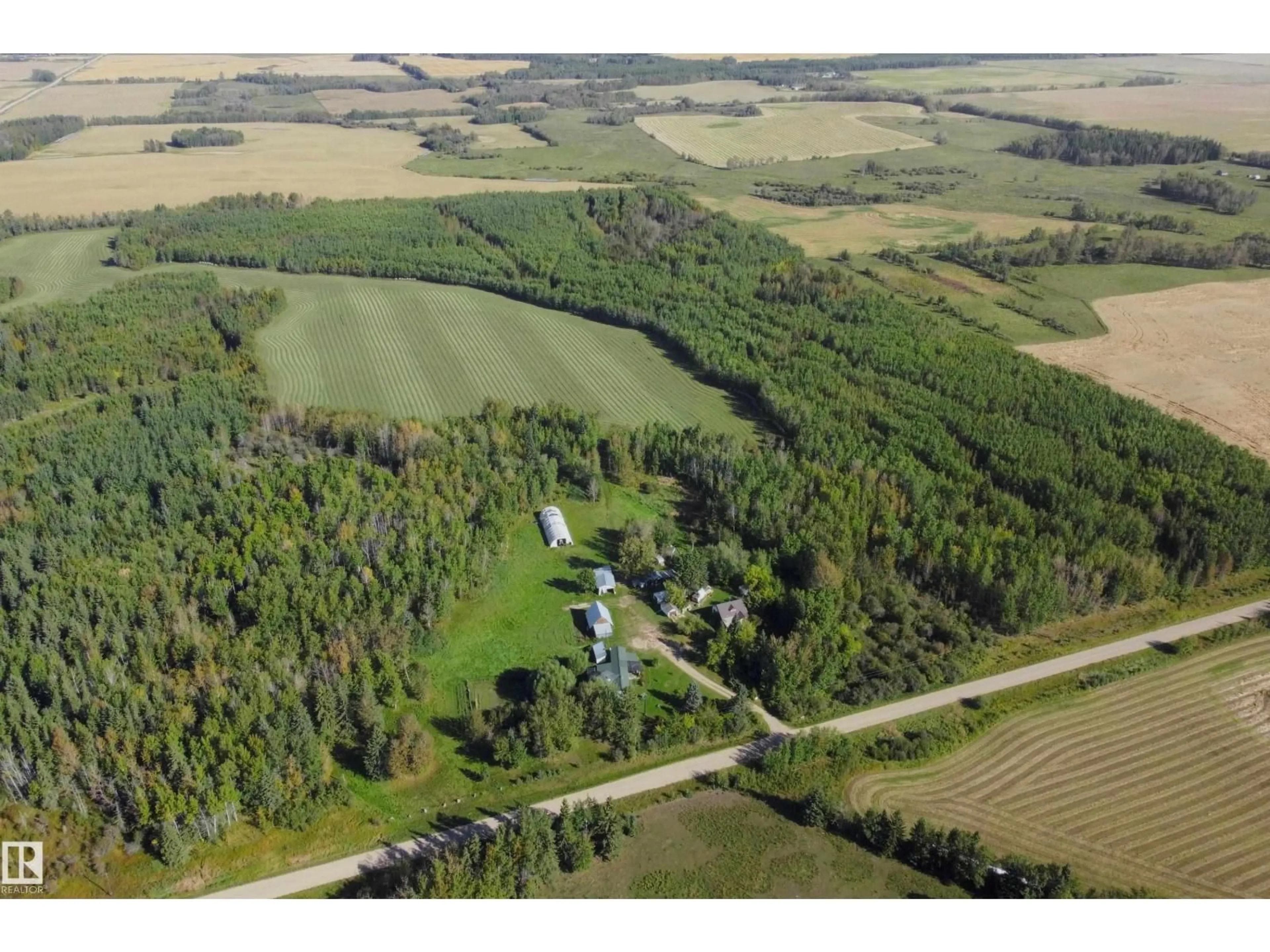 A pic from outside/outdoor area/front of a property/back of a property/a pic from drone, forest/trees view for 763 HWY 763, Rural Barrhead County Alberta T7N1N3