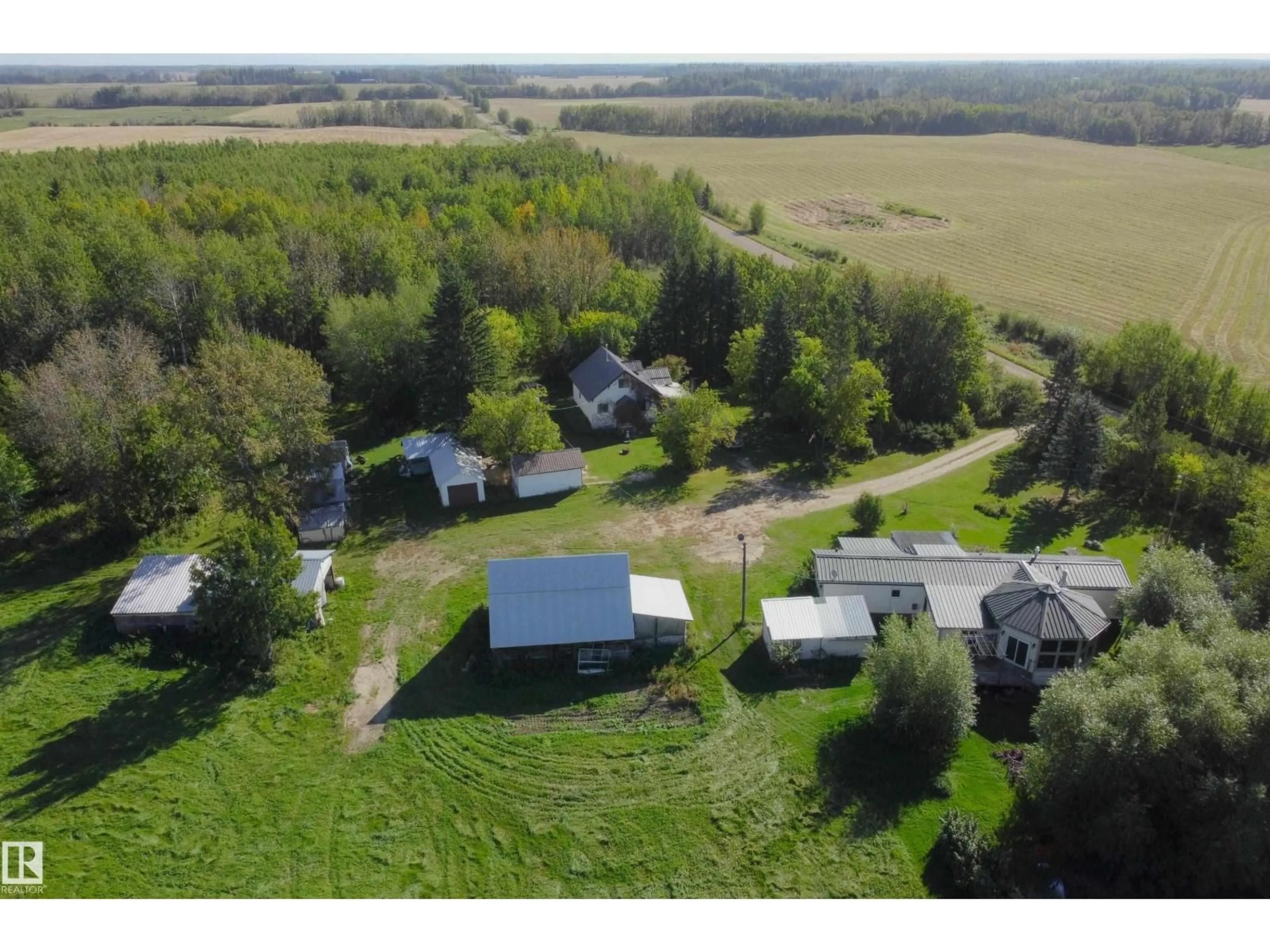 A pic from outside/outdoor area/front of a property/back of a property/a pic from drone, unknown for 763 HWY 763, Rural Barrhead County Alberta T7N1N3