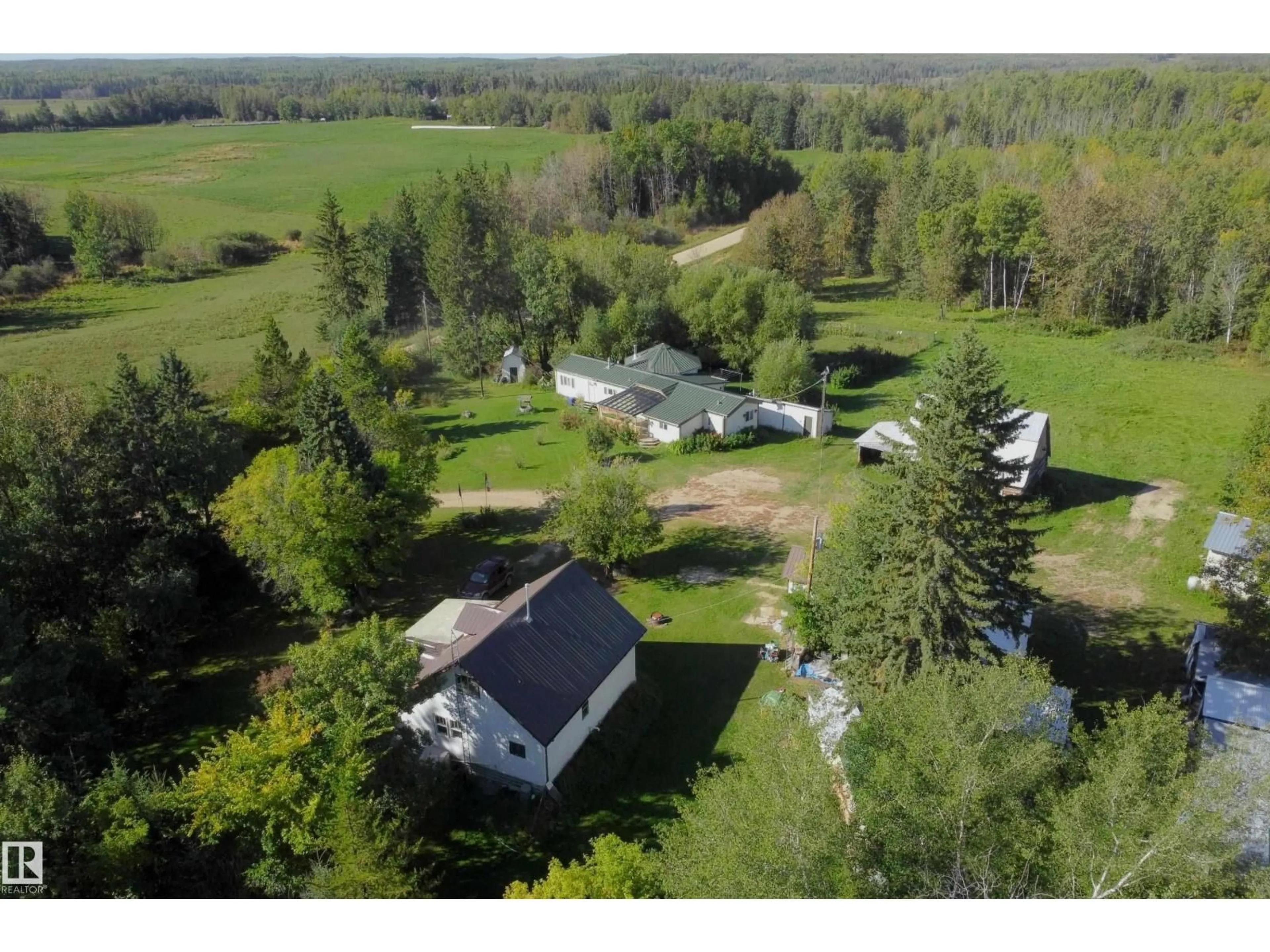 A pic from outside/outdoor area/front of a property/back of a property/a pic from drone, unknown for 763 HWY 763, Rural Barrhead County Alberta T7N1N3