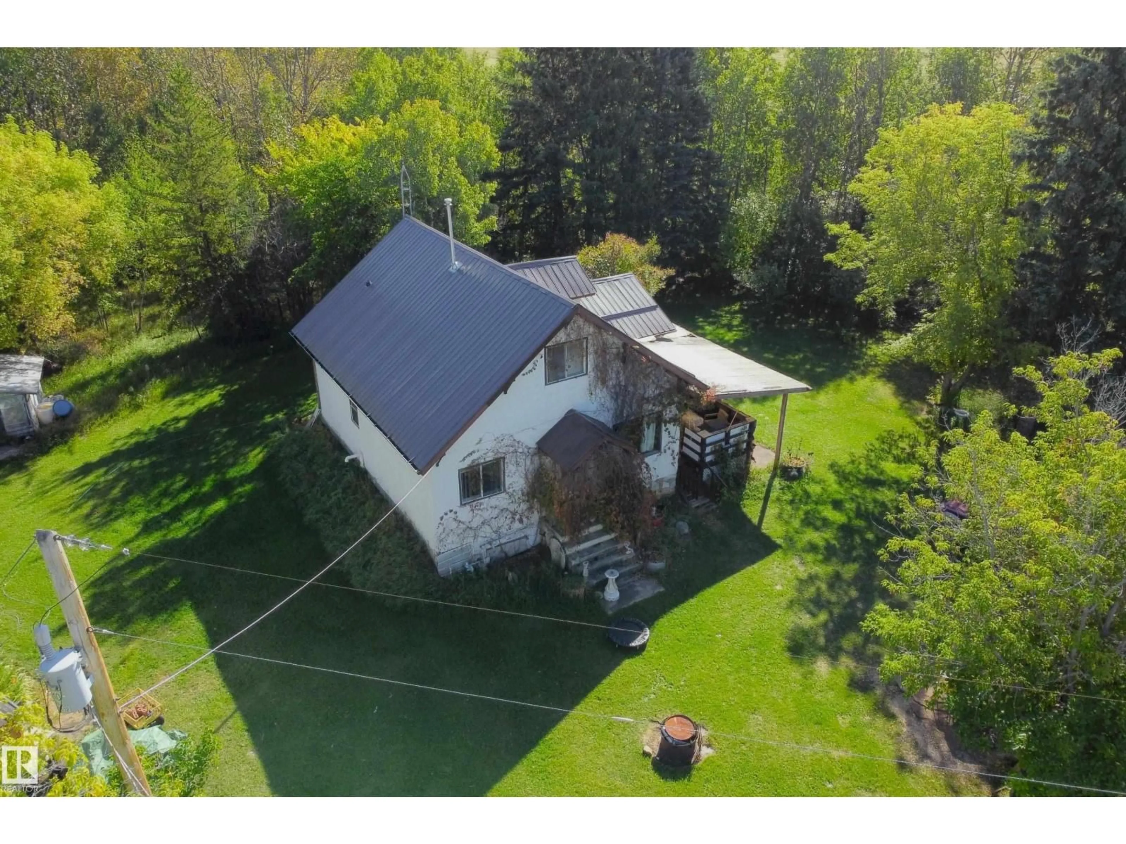 A pic from outside/outdoor area/front of a property/back of a property/a pic from drone, unknown for 763 HWY 763, Rural Barrhead County Alberta T7N1N3