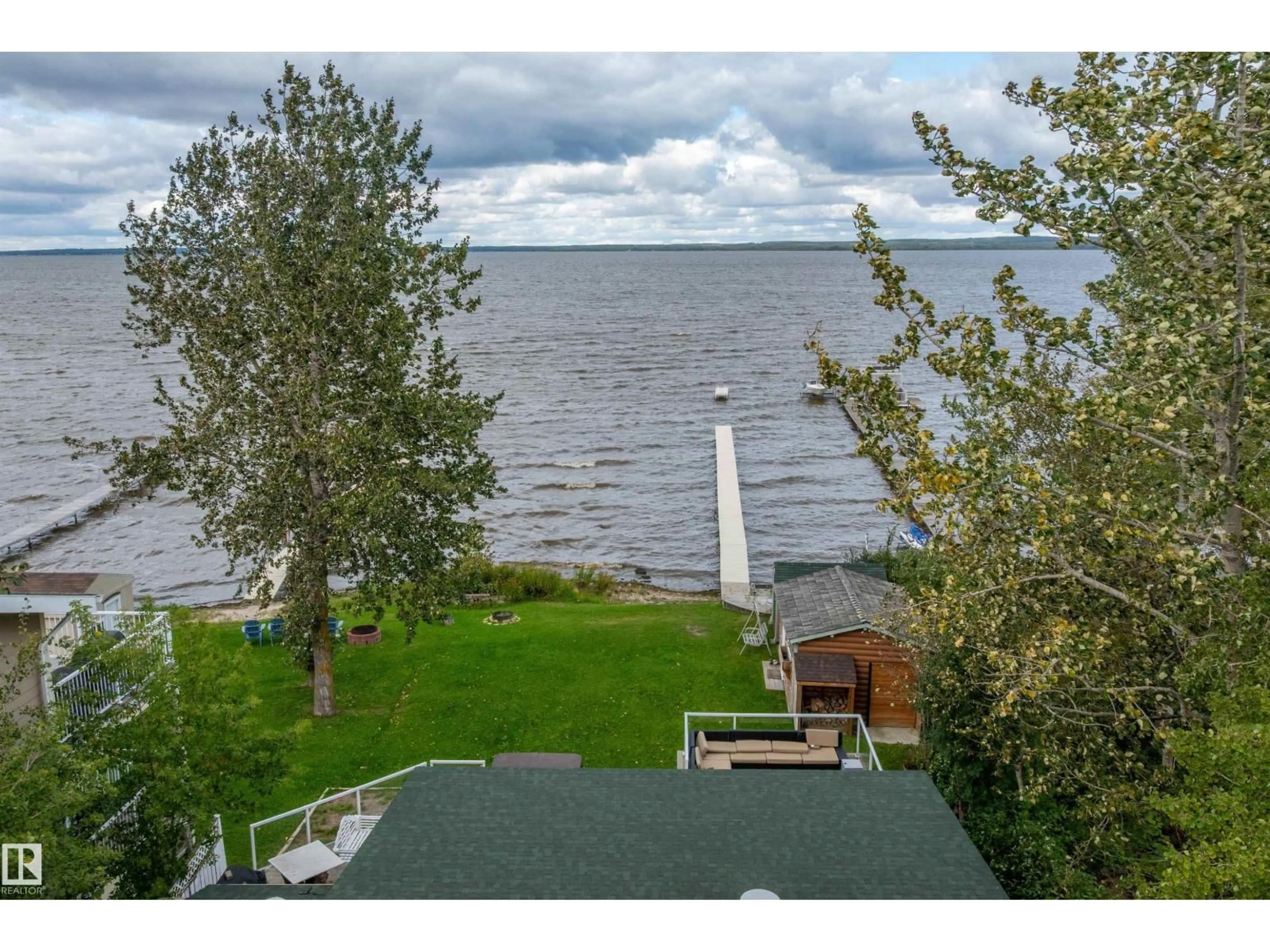 A pic from outside/outdoor area/front of a property/back of a property/a pic from drone, water/lake/river/ocean view for 10 - 50 RGE ROAD, Rural Wetaskiwin County Alberta T0C2V0