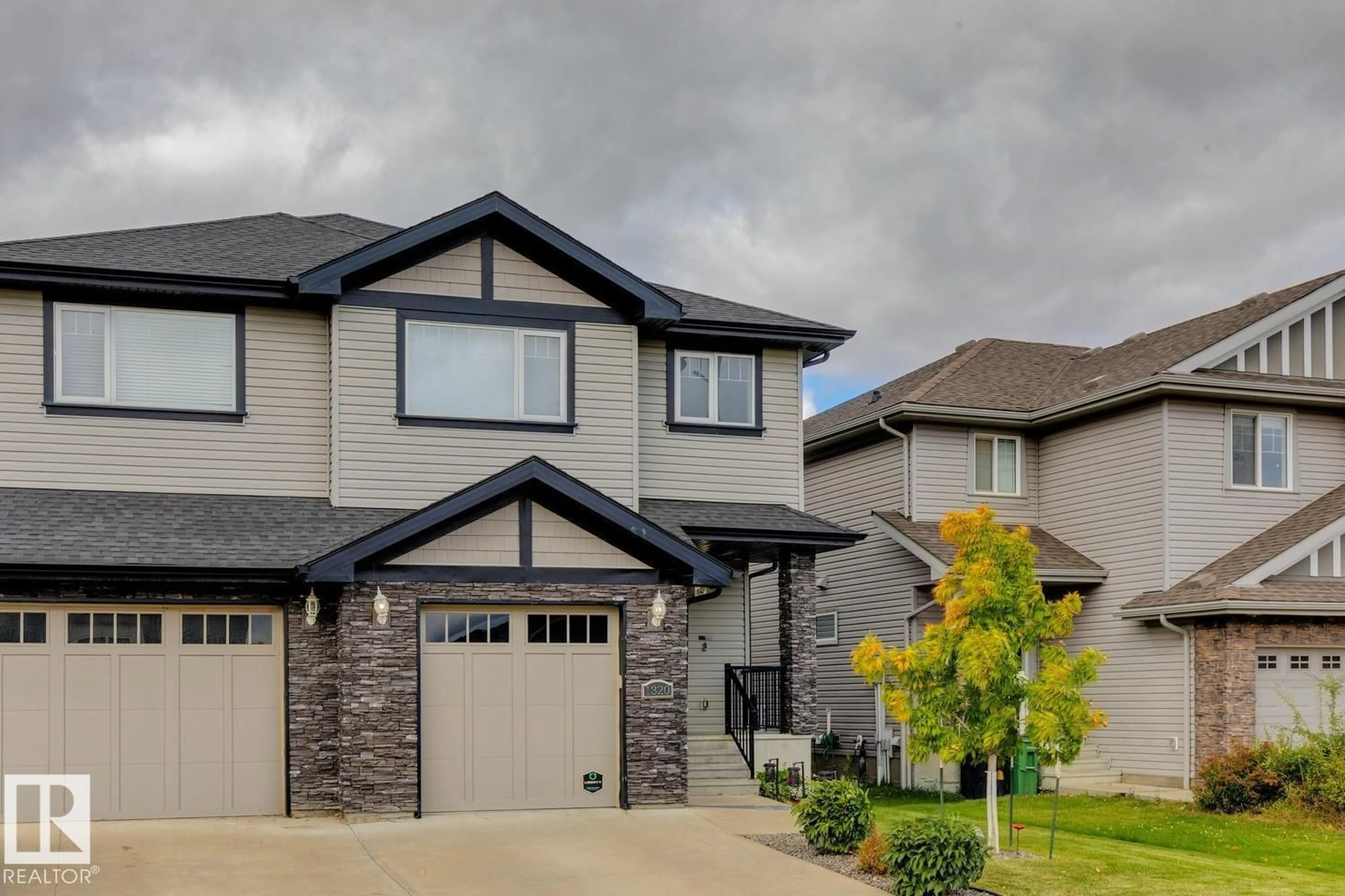 Home with vinyl exterior material, street for SW - 1320 162 ST, Edmonton Alberta T6W2L1