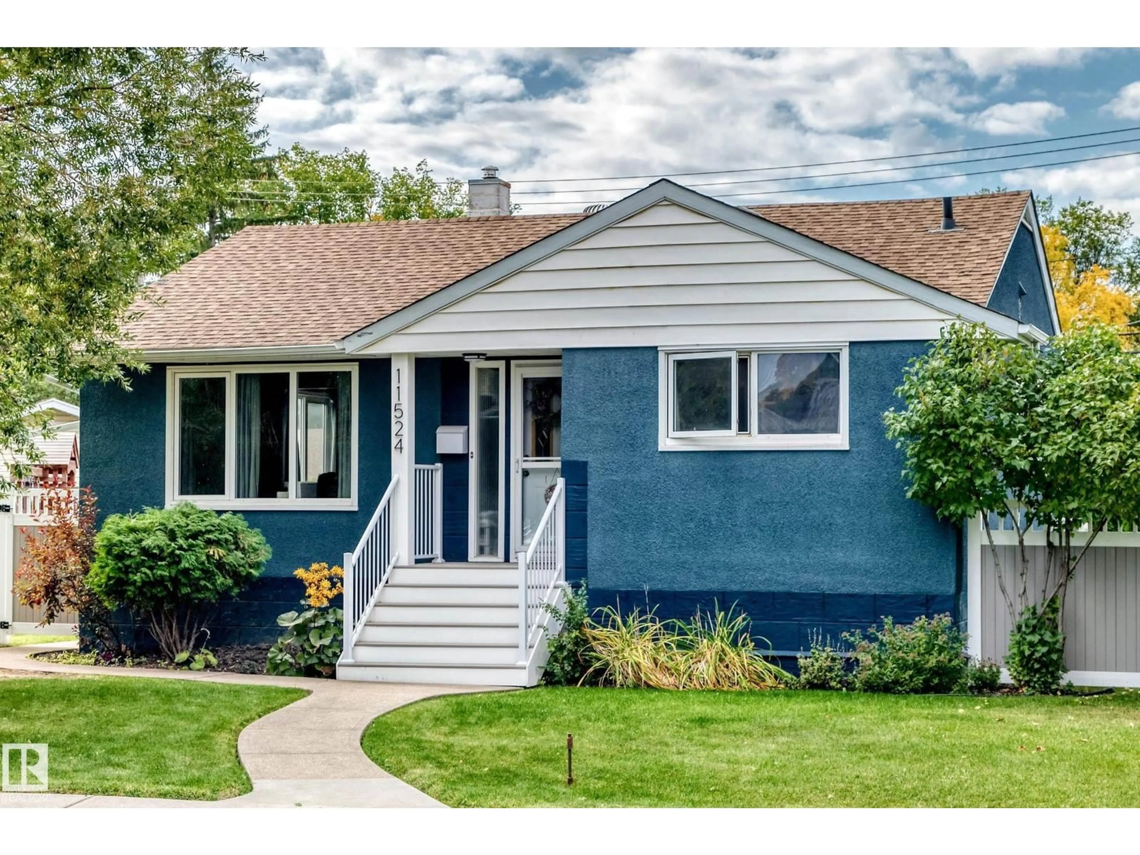 Home with vinyl exterior material, street for 11524 133 ST, Edmonton Alberta T5M1H4